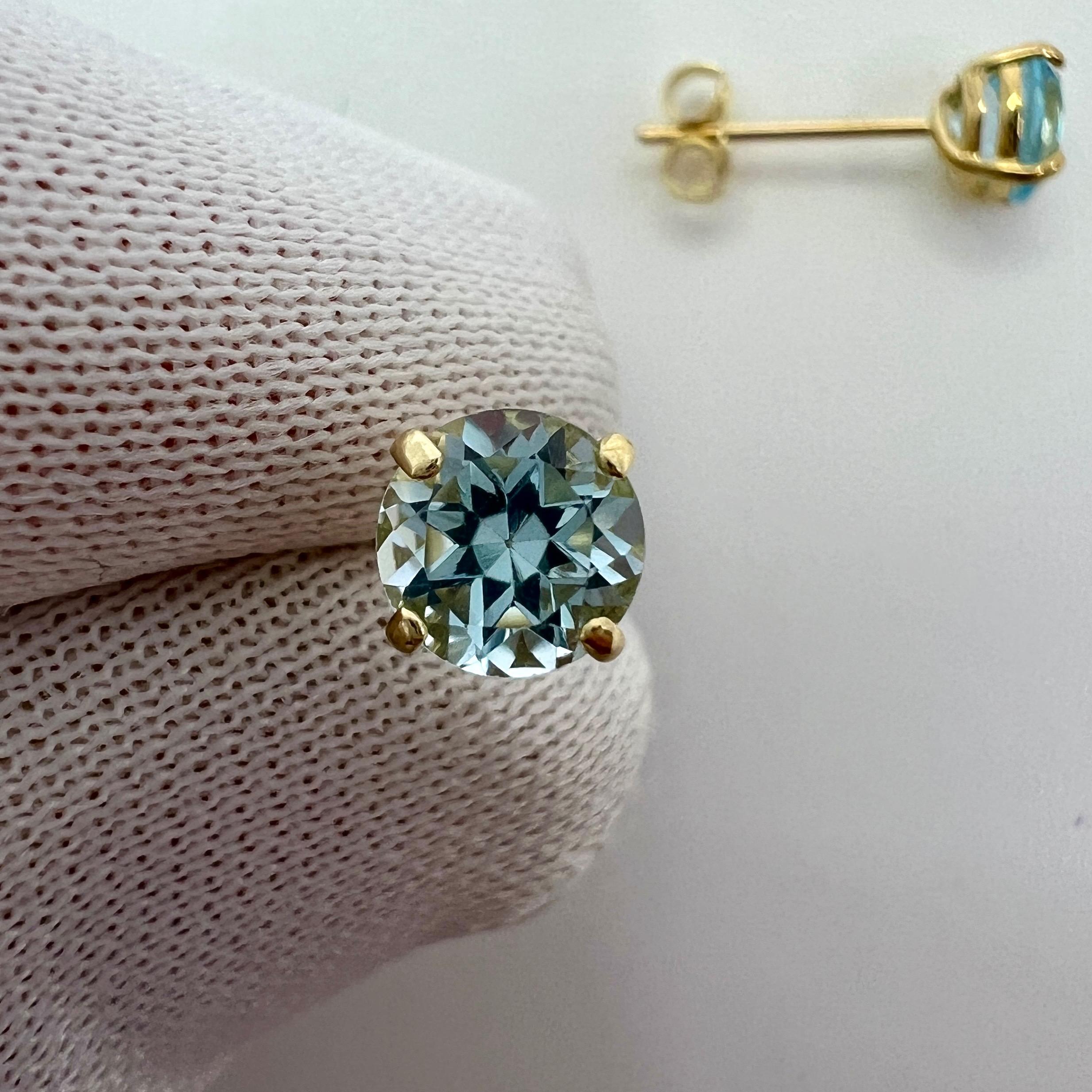 Natural Bright Blue Topaz 9k Yellow Gold Earring Studs.

Beautiful 5mm matching pair of round topaz with bright blue colour, excellent clarity and an excellent round brilliant cut.

Set in lightweight 9k yellow gold studs with butterfly
