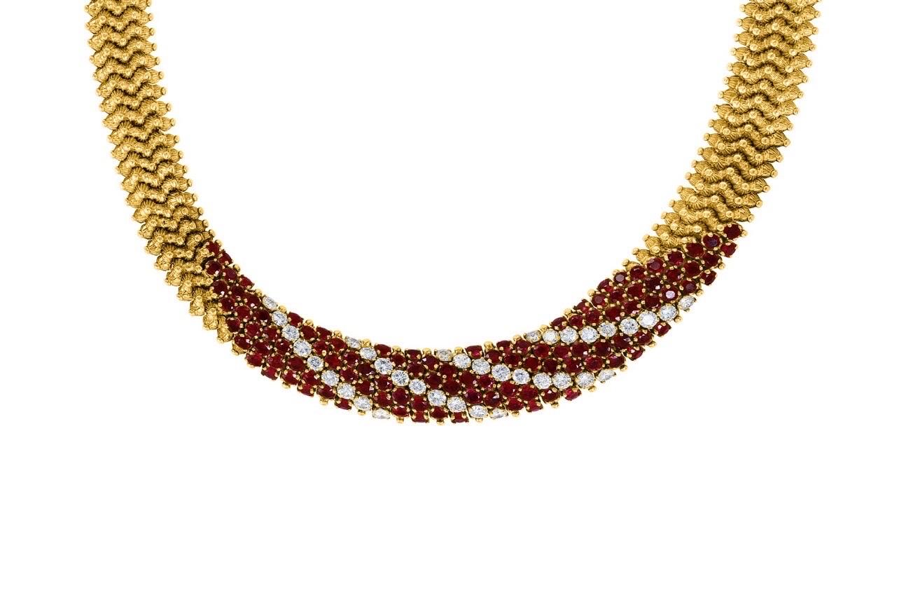 Natural 12 Ct Burma Ruby and 5 ct Diamond Necklace 18 Karat Yellow Gold 166gm 
This Necklace made out of 18 Karat Yellow gold . 
Necklace consisting of 4 oblique rows of diamonds 
Total diamond weight is approximately 5 ct 
Necklace has 13 oblique