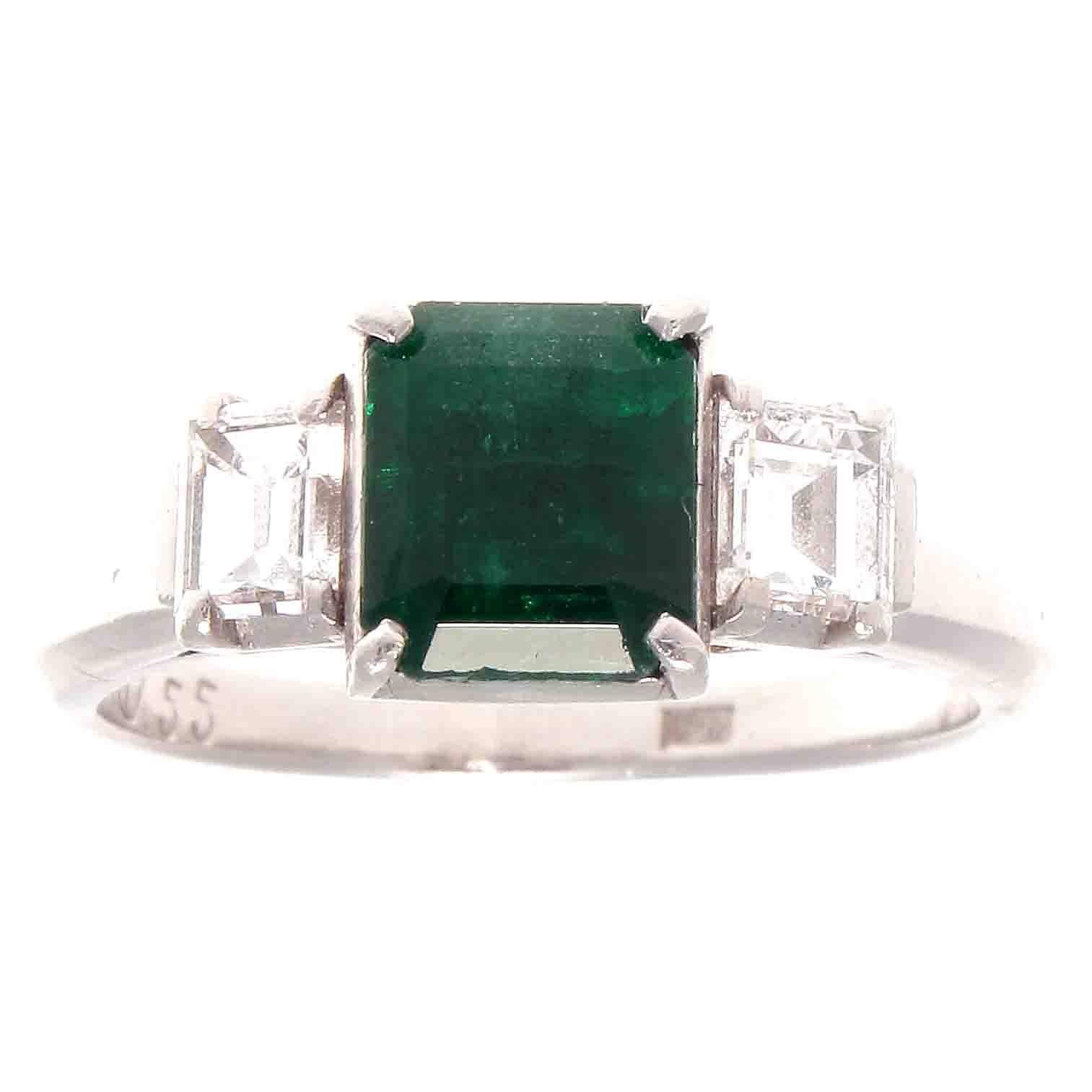 A classic creation and style that has survived many decades of change. Featuring a 1.22 carat forest green emerald that is perfectly complimented by 2 colorless emerald cut diamonds weighing a total of 0.55 carats. Crafted in platinum.

Ring size 6