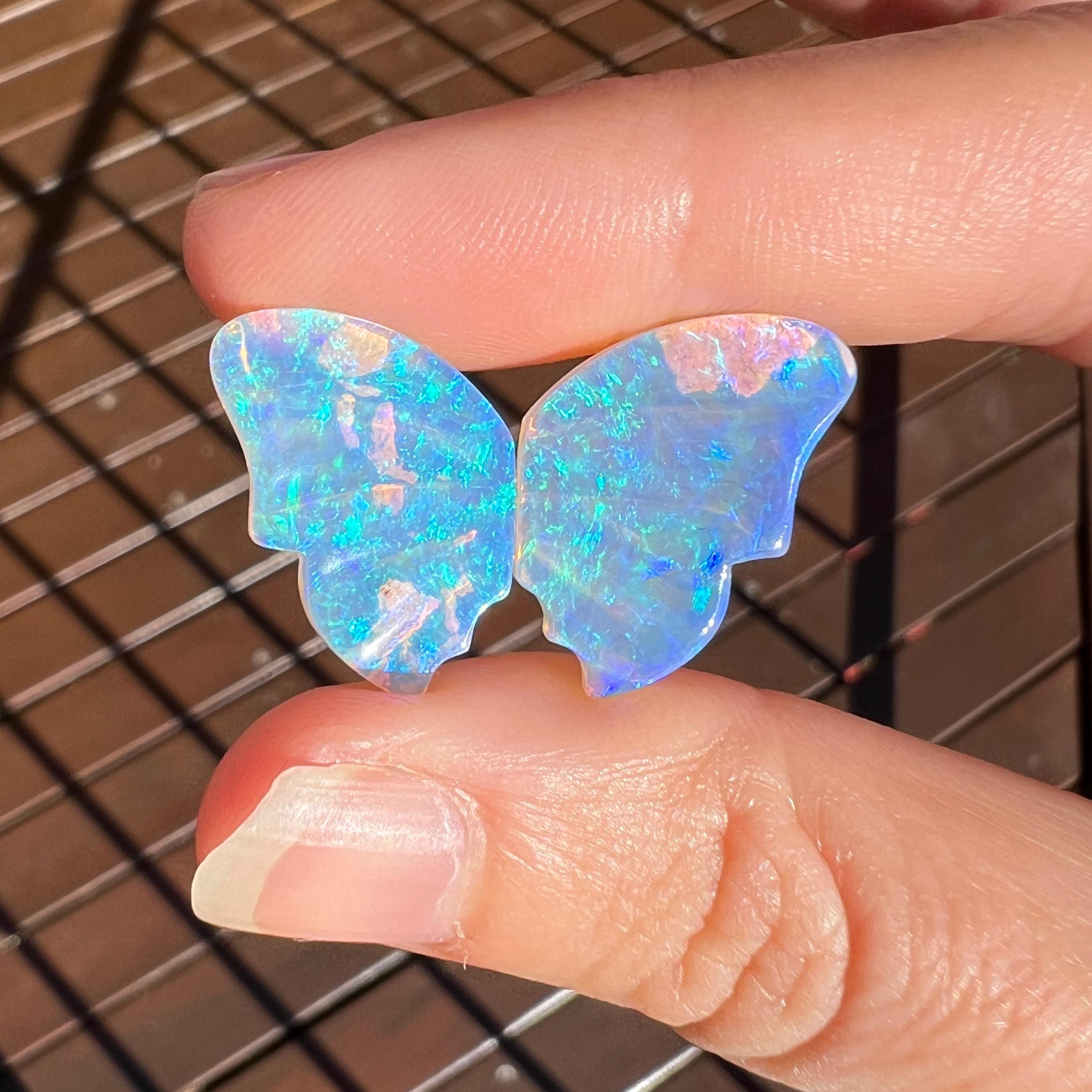 This beautiful 12.35 Ct natural Australian gem crystal opal, carved into a pair of butterfly wings, is a truly exceptional addition to any collection, mined by Sue Cooper herself. Its rarity, coupled with the amazing winged carving, captivates