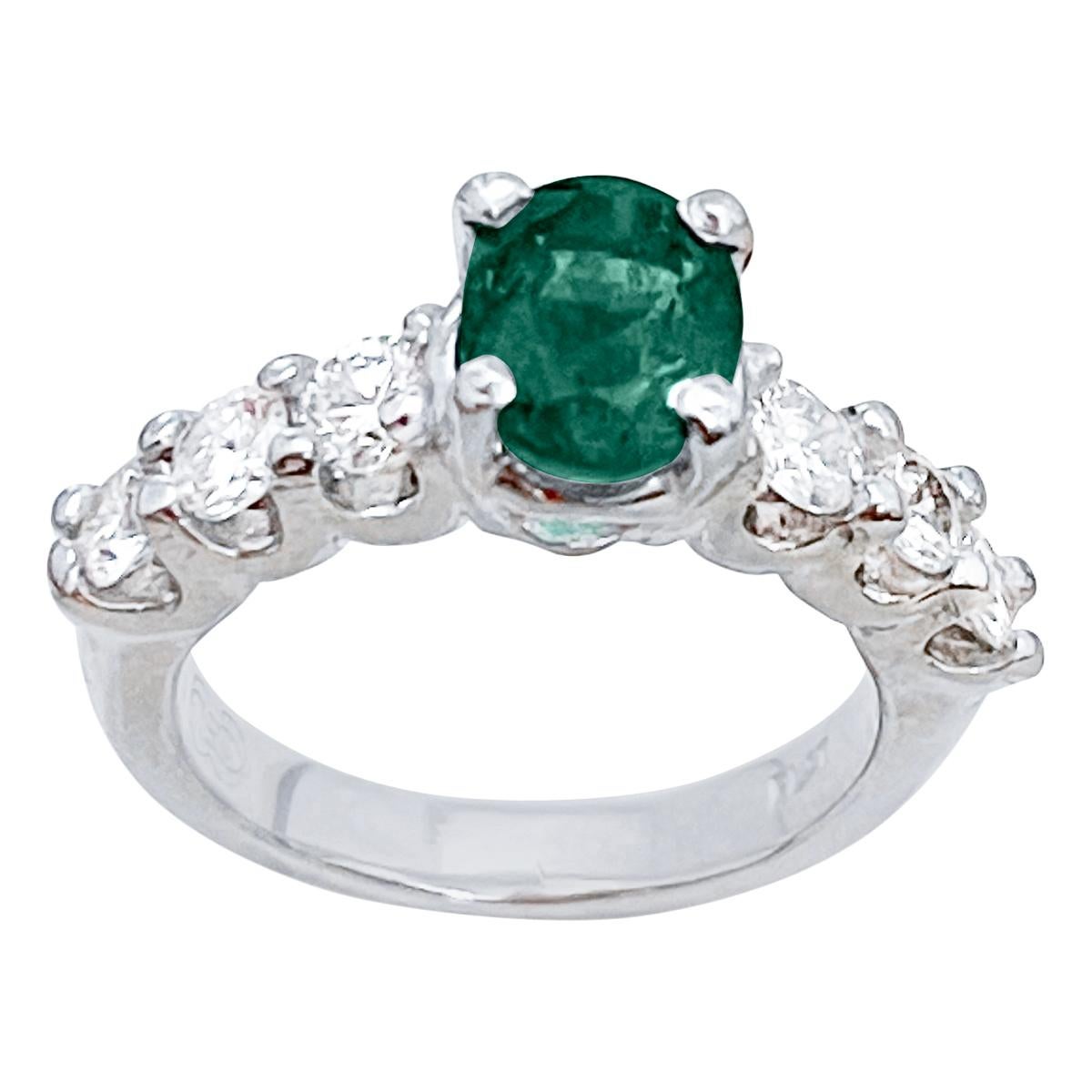 Natural 1.25 Carat Oval Cut Emerald & 0.90 Carat Diamond Ring Platinum For Sale