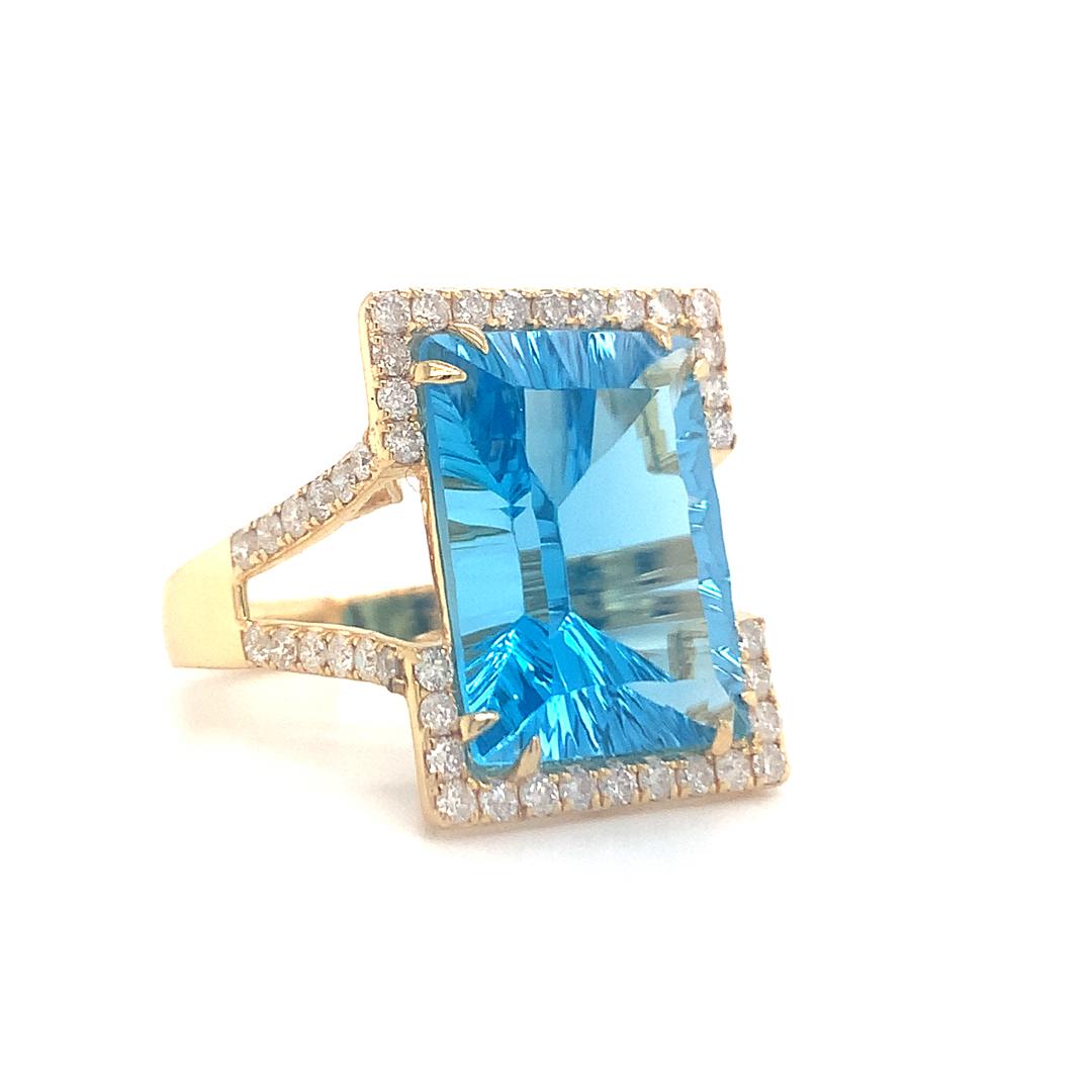 Emerald Cut Natural 13.20 carat blue topaz with diamond gold ring