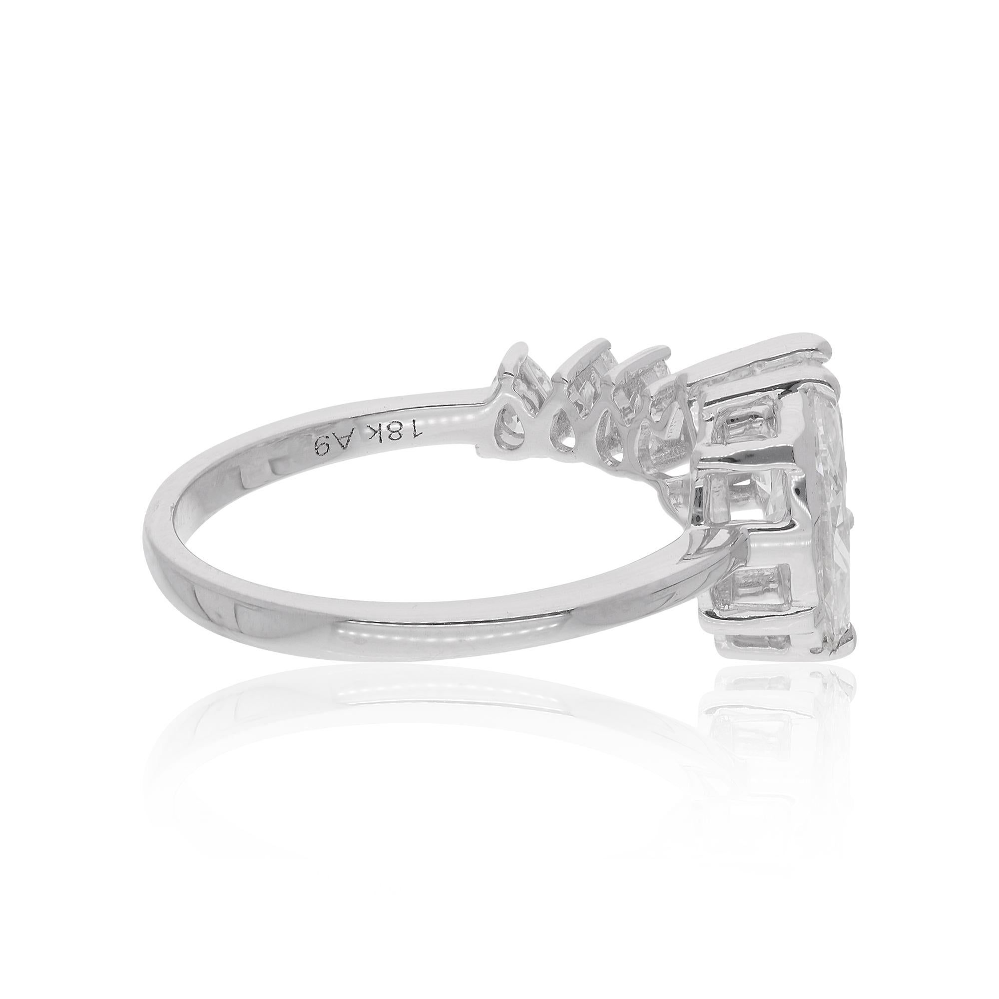 At the heart of the ring, a captivating pear-shaped diamond takes center stage, flanked by delicate marquise-cut diamonds. The pear and marquise-cut diamonds total 1.33 carats, each meticulously selected for its exceptional clarity, brilliance, and