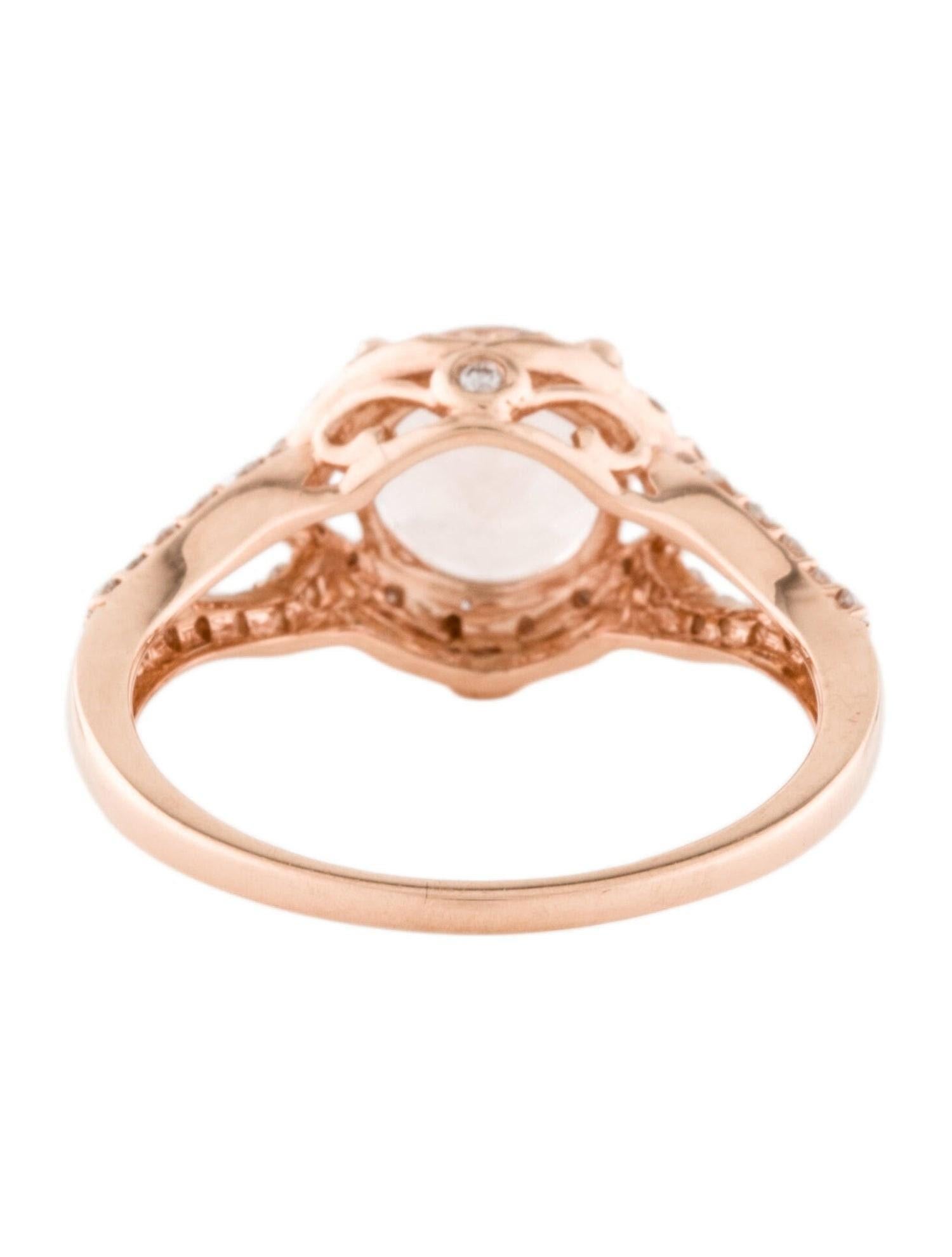 This is an alluring natural 1.36CT morganite and diamond ring set in solid 14K rose gold. The natural round cut morganite has an excellent peachy pink color and is surrounded by a halo of round cut white diamonds. The ring is stamped 14K and is a