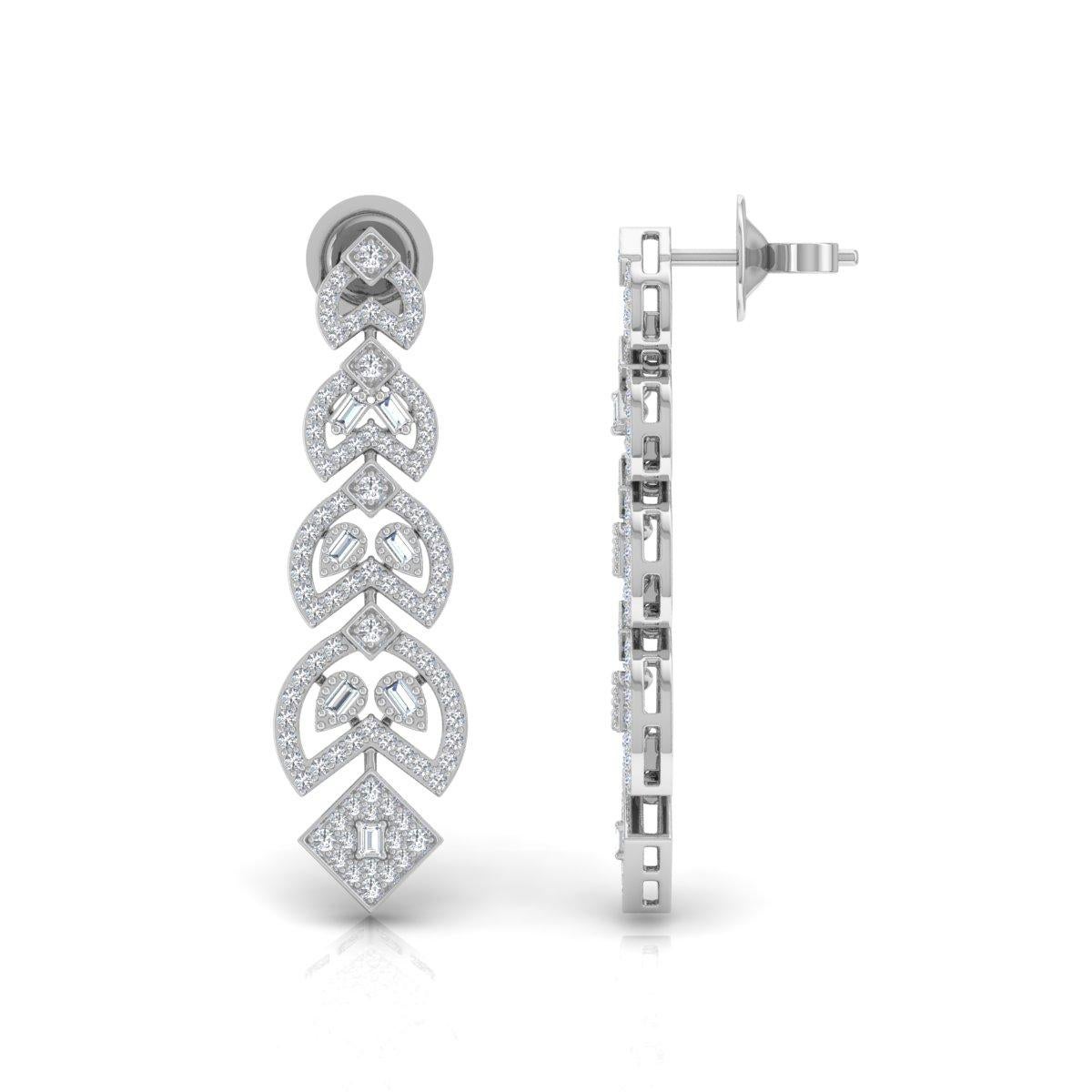 Ti presentiamo i nostri orecchini penzolanti con diamante baguette certificato da 1,40 carati, realizzati con squisita precisione in un radioso oro giallo 18 carati. Questi orecchini non sono solo un gioiello, ma una dichiarazione di eleganza e