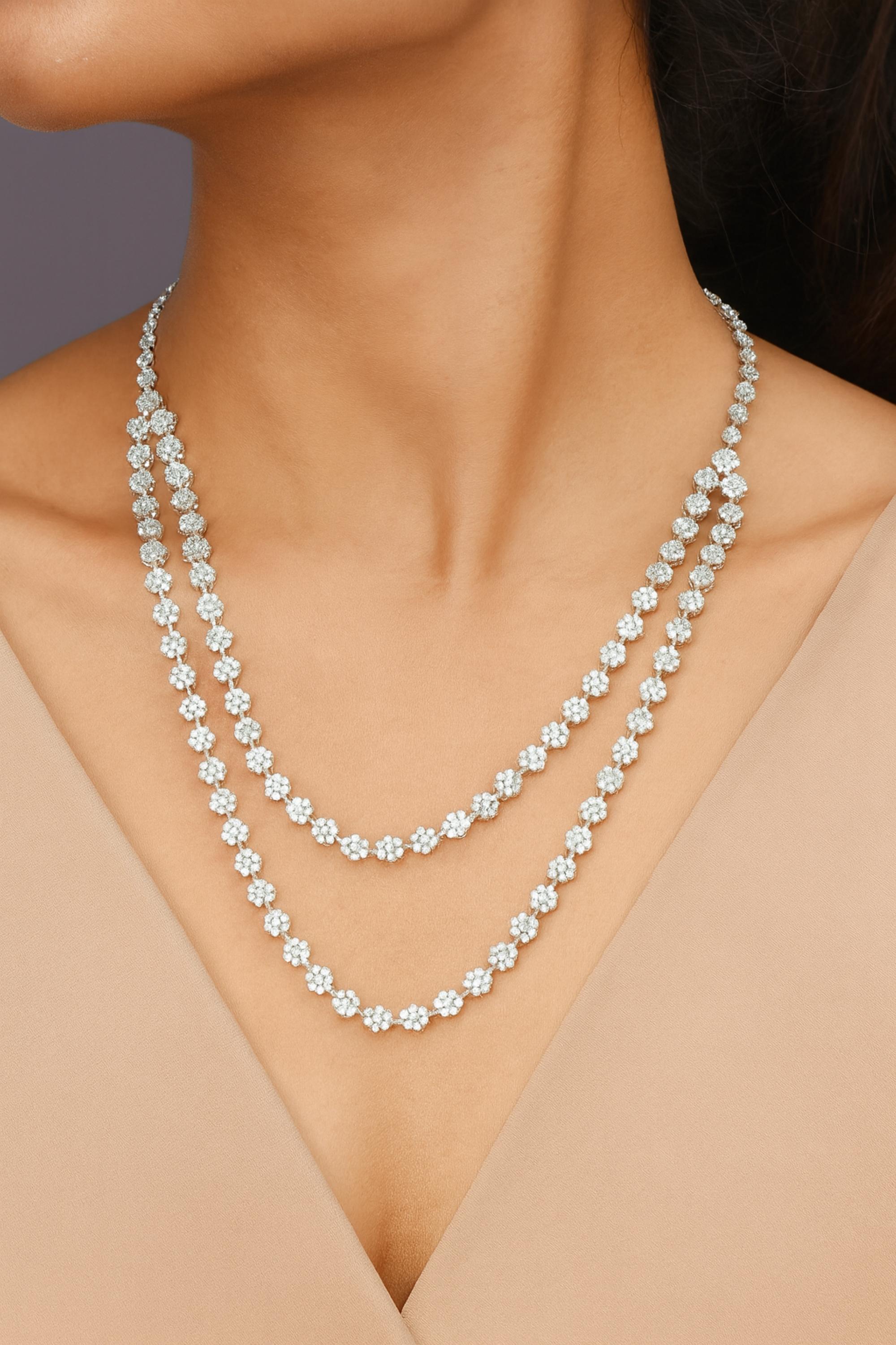 Natural 14.2 Carat Double Layer Diamond Floral Necklace 14 Karat White Gold 
It features a two-layer design, each strand gracefully adorned with dazzling floral diamond clusters. Each flower motif is meticulously crafted with round-cut