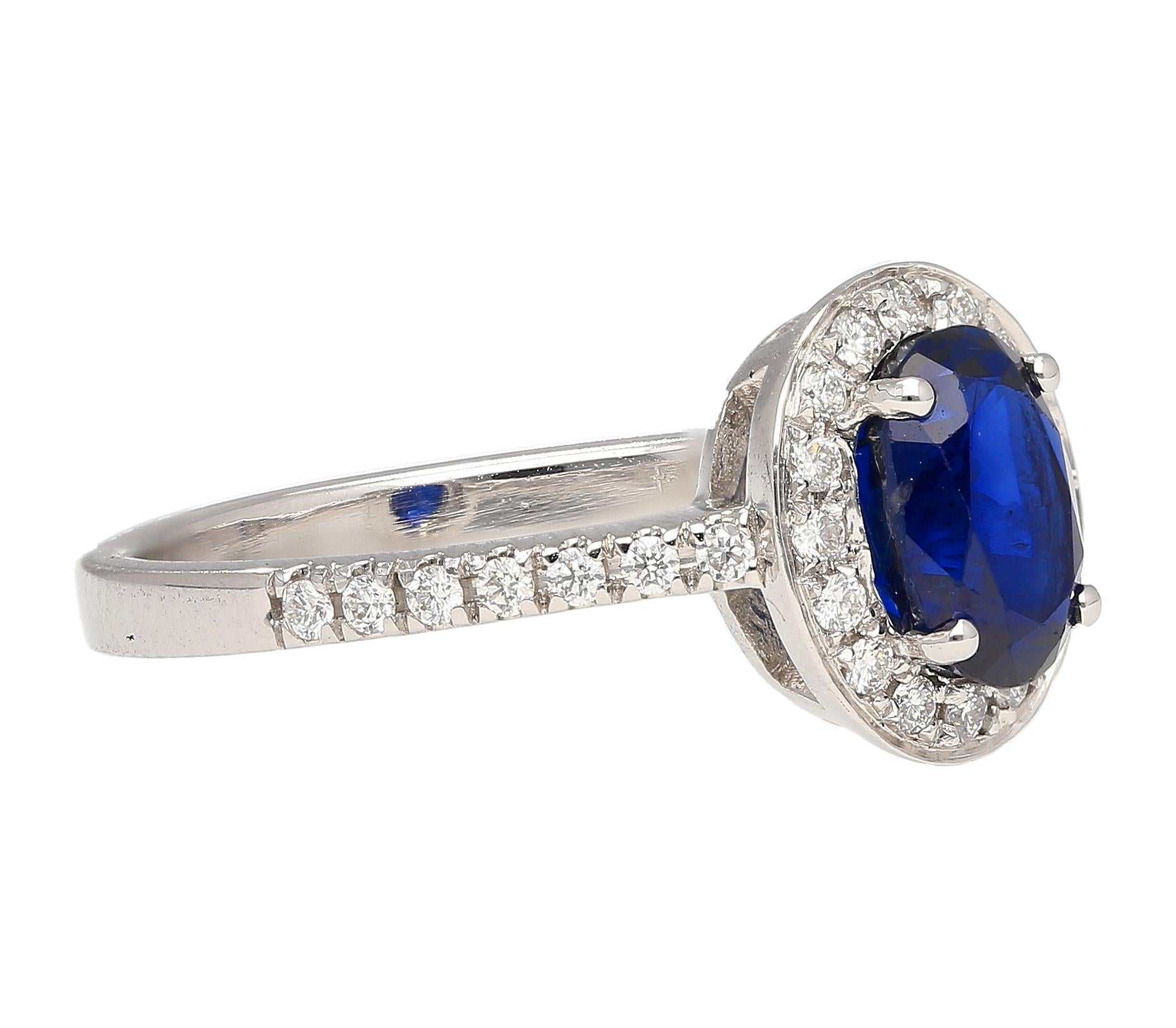 Natural 1.45 Carat Oval Cut Blue Sapphire and Diamond Halo 18k White Gold Ring In New Condition For Sale In Miami, FL