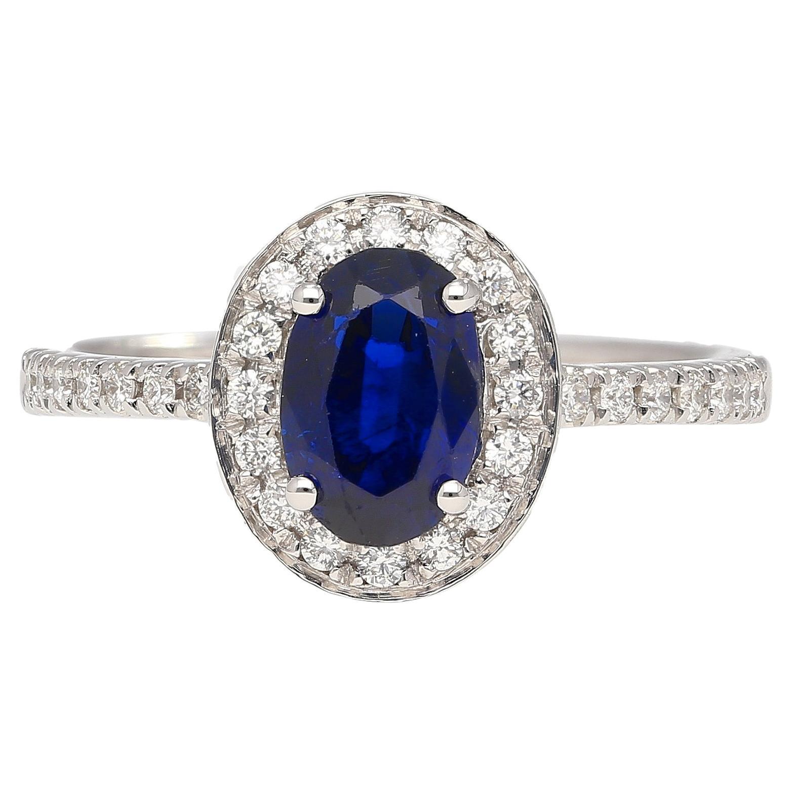 Natural 1.45 Carat Oval Cut Blue Sapphire and Diamond Halo 18k White Gold Ring For Sale