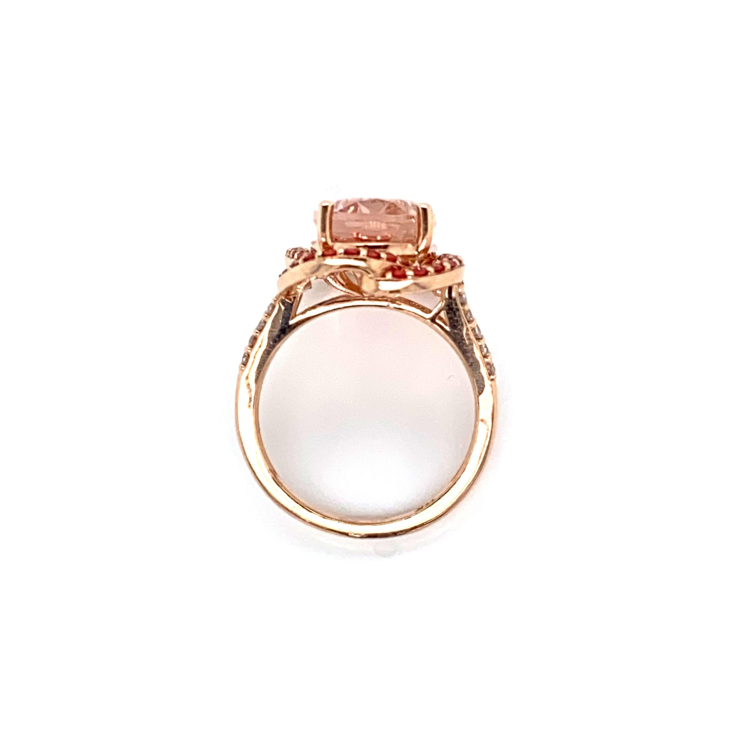 This is a magnificent natural 5.77CT morganite and diamond ring set in solid 14K rose gold. The natural 14x10MM Morganite oval has an excellent peachy pink color and is set on top of a gorgeous diamond encrusted shank. The ring is stamped 14K and is