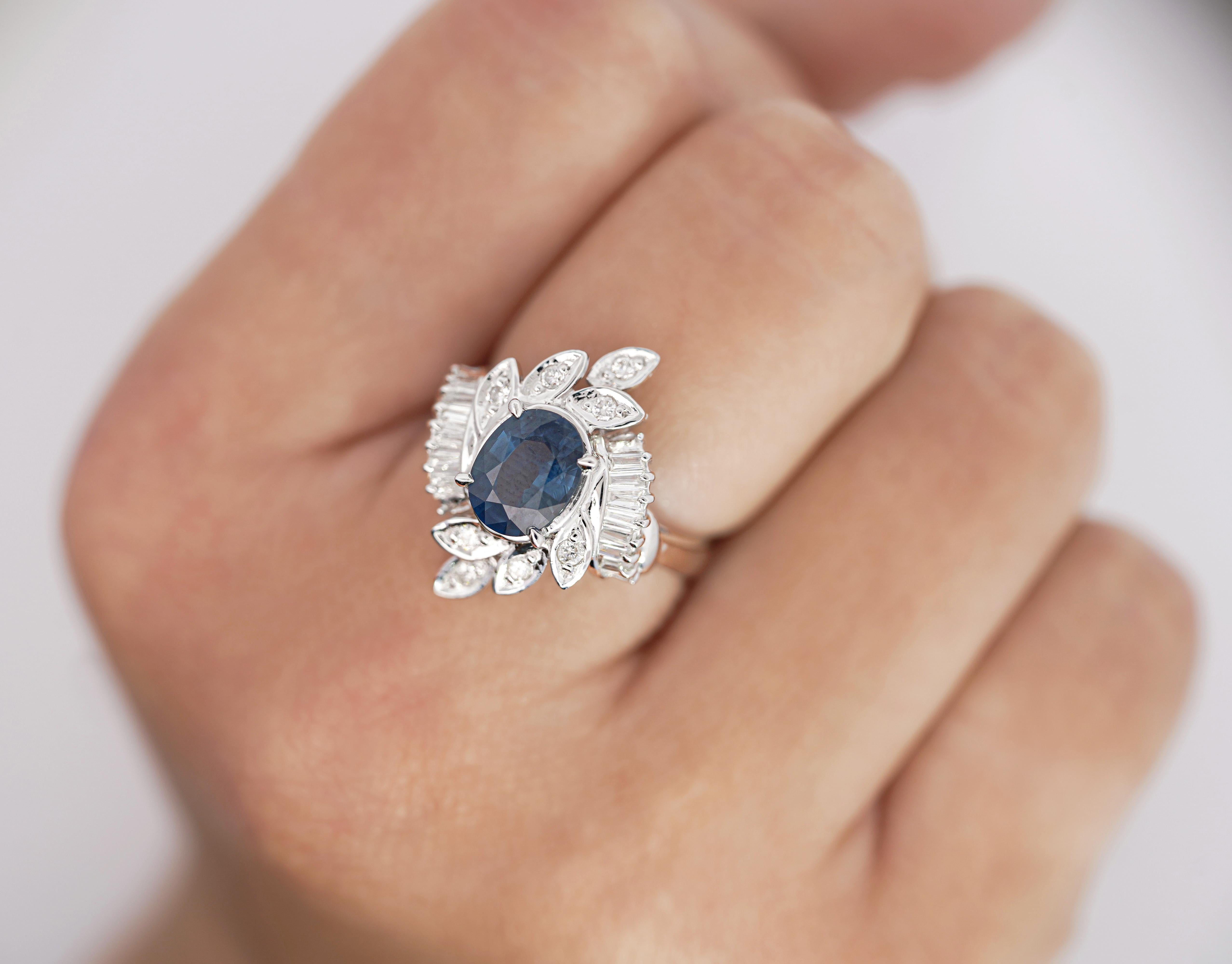 Natural Oval Cut Blue Sapphire and Diamond Platinum Floral Motif Ring.

This cocktail ring is crafted from a platinum 900 ring setting. The main stone is a natural blue sapphire with good transparency, color, and clarity. The sapphire is oval-cut