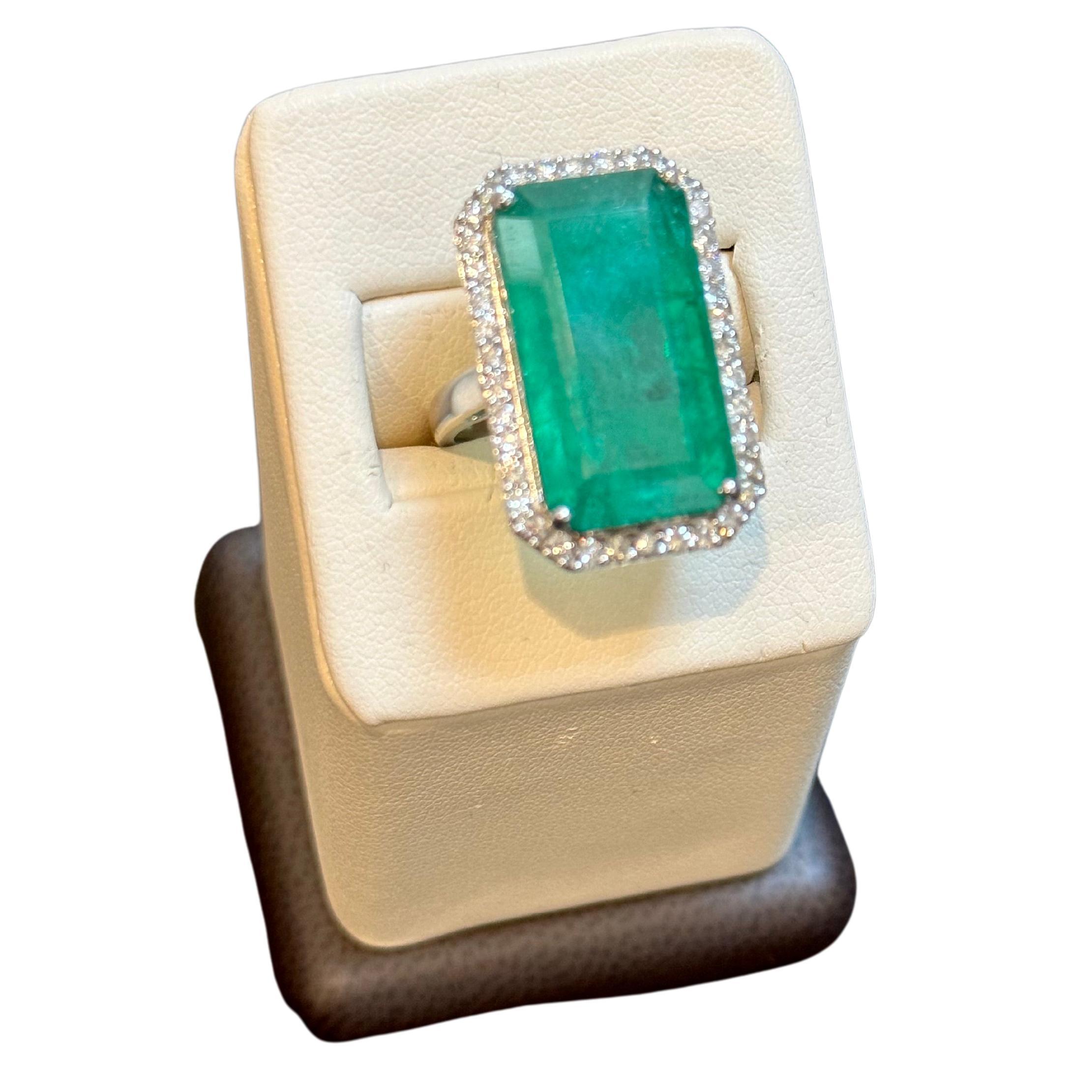 Natural 16 Carat Emerald Cut Zambian Emerald & Diamond Ring in 14Kt  White Gold
A classic design  ring , Ring Size 6.75
Exact 16 Carat  Emerald Cut Emerald Absolutely gorgeous emerald , Very desirable color .
Origin Zambia
14 Karat white gold   9 gm