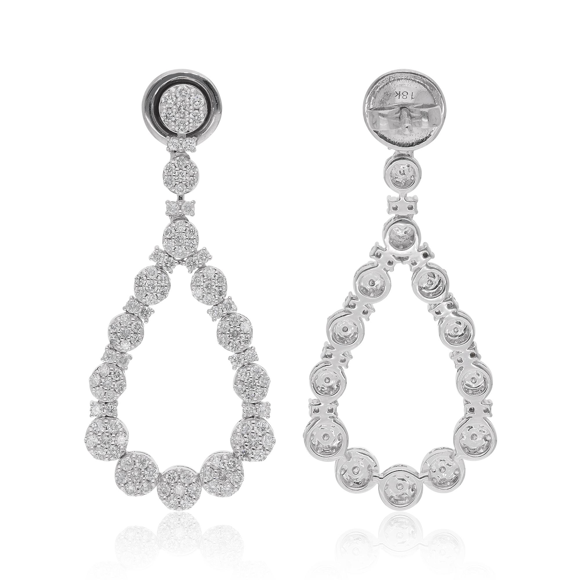 Elevate your ensemble with the enchanting allure of these Natural 1.62 Carat Round Diamond Dangle Earrings, meticulously crafted in 18 Karat White Gold. Each earring is a testament to sophistication and timeless beauty, designed to captivate