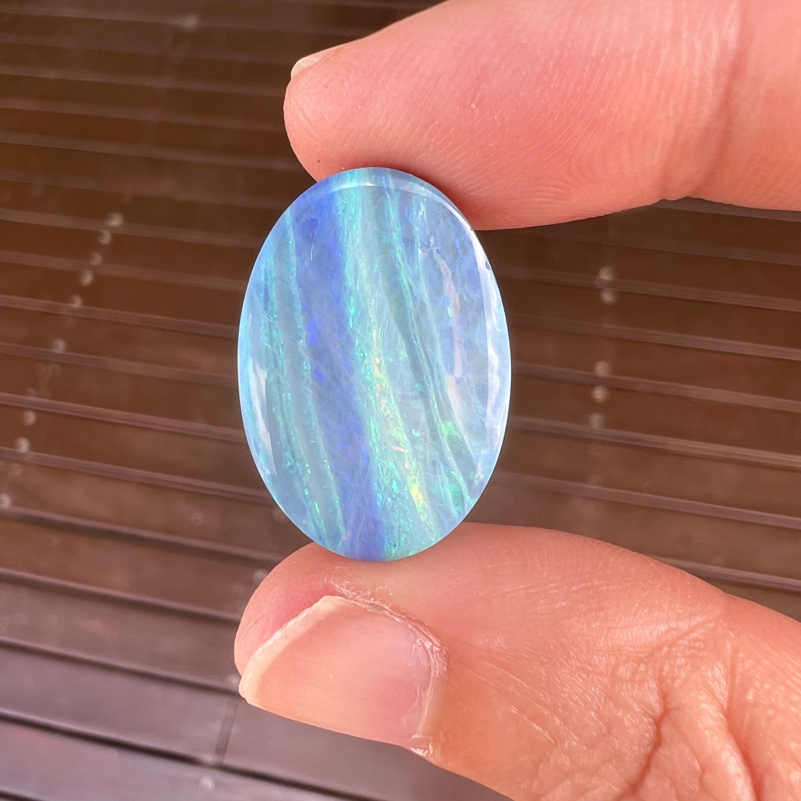 This amazing 17.99 Ct Australian boulder opal was mined by Sue Cooper at her Mt. Margaret opal mine in western Queensland, Australia in 2022. Sue processed the rough opal herself and cut into into an large oval shape. We especially love the ocean