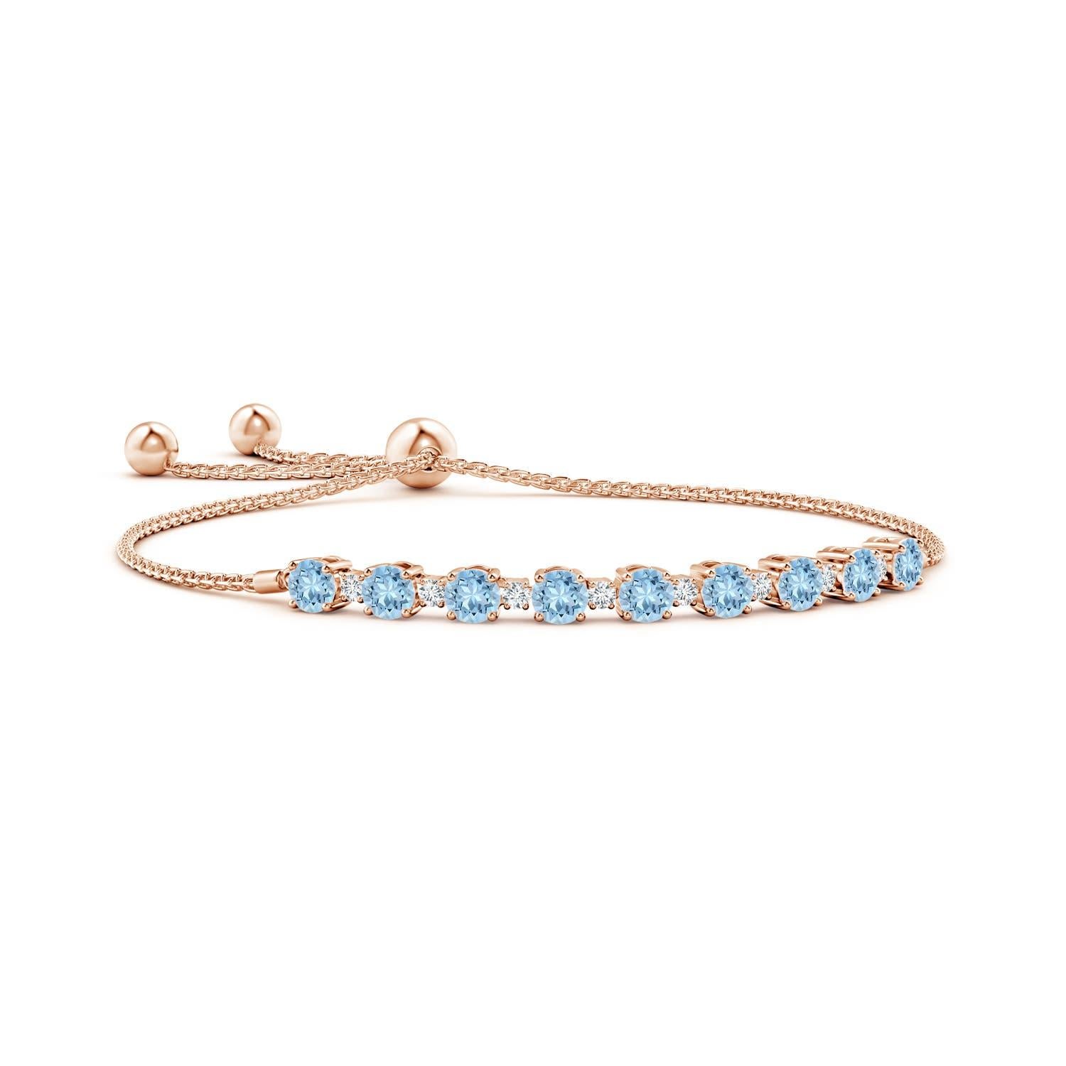 Sea blue aquamarines and glittering diamonds come together on this 14k rose gold tennis bolo bracelet. They are prong set alternately and create a classic look. This bracelet is adjustable to fit most wrists.