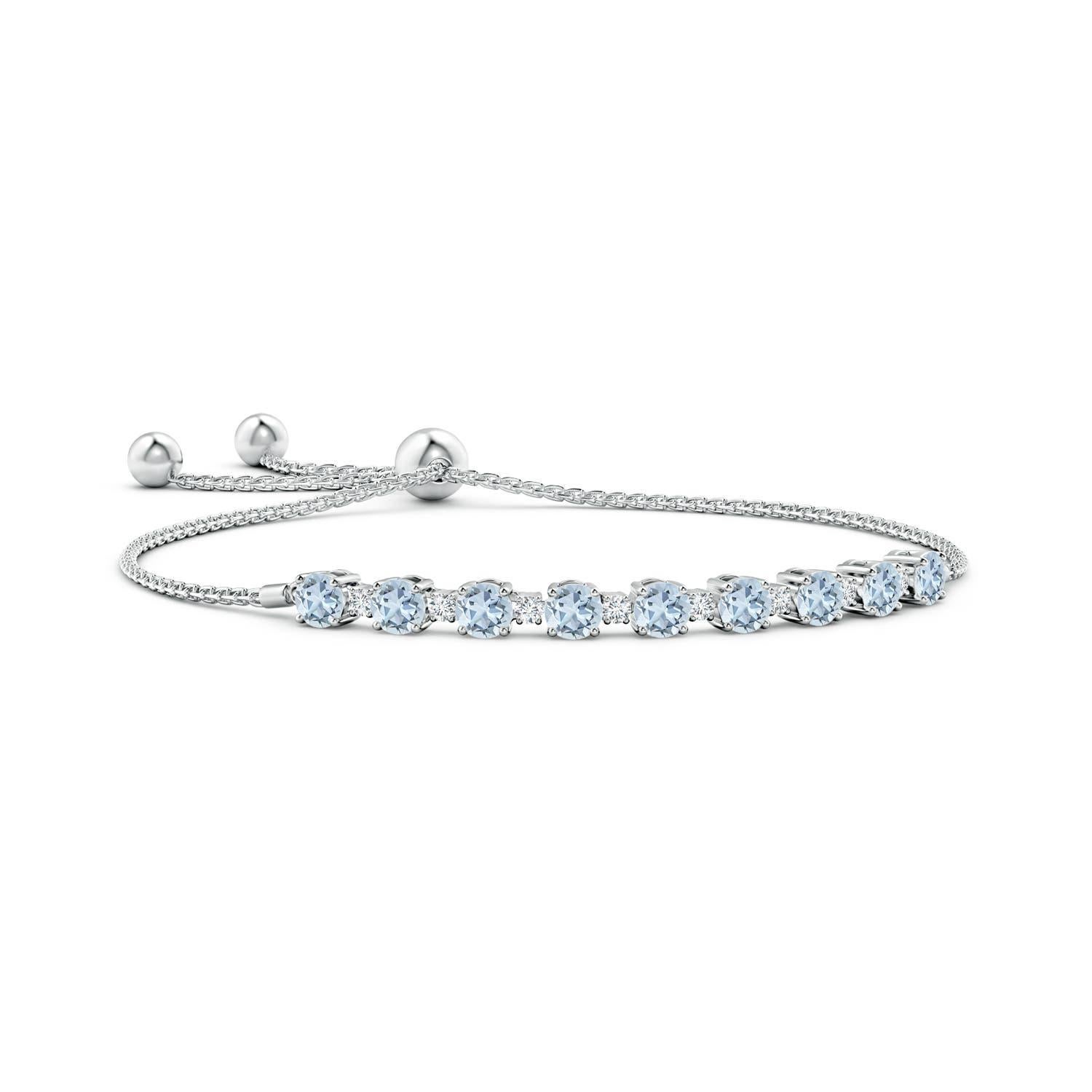 Sea blue aquamarines and glittering diamonds come together on this 14k white gold tennis bolo bracelet. They are prong set alternately and create a classic look. This bracelet is adjustable to fit most wrists.