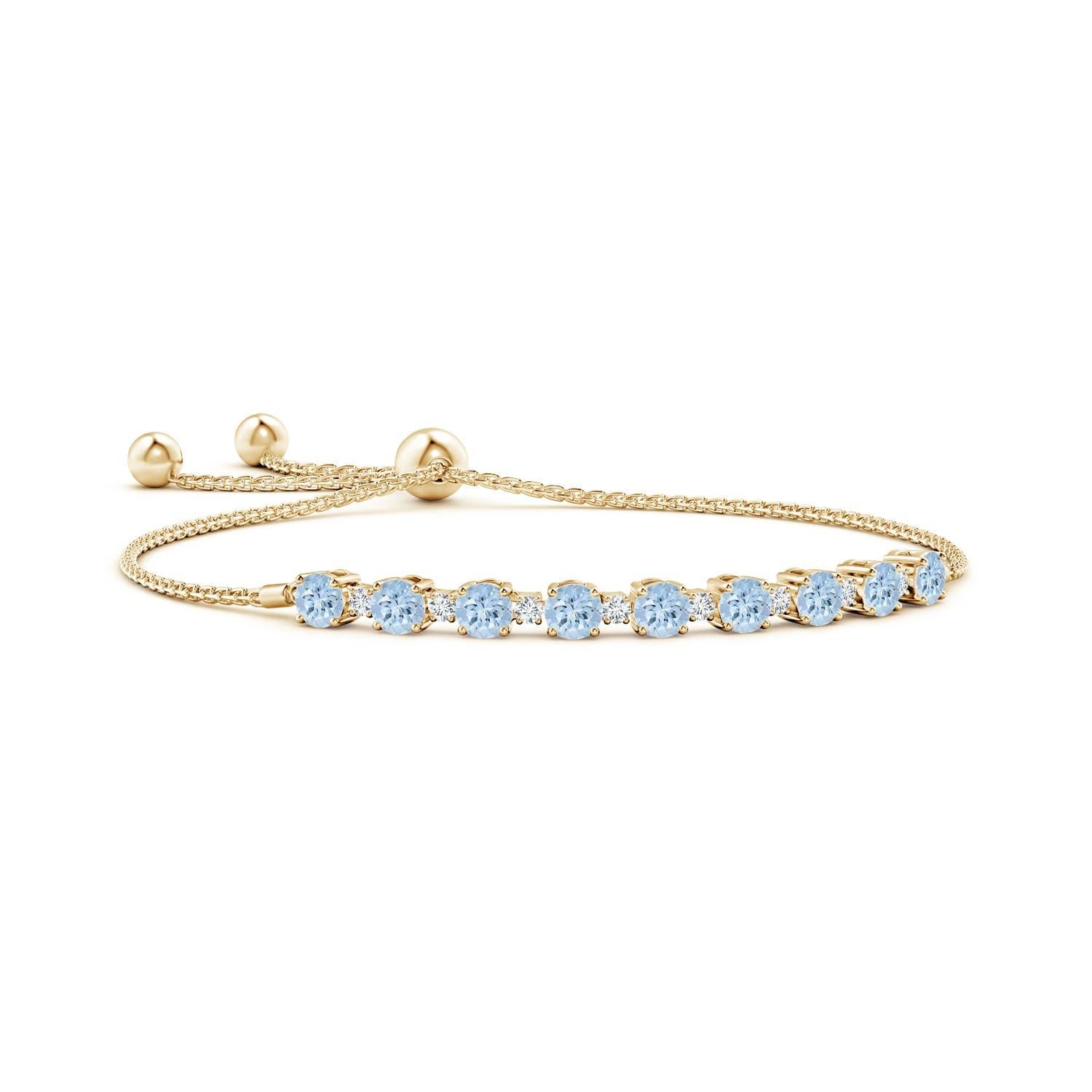 Des aigues-marines bleues et des diamants scintillants sont réunis sur ce bracelet bolo en or jaune 14k. Elles sont serties en alternance et créent un look classique. Ce bracelet est réglable pour s'adapter à la plupart des poignets.