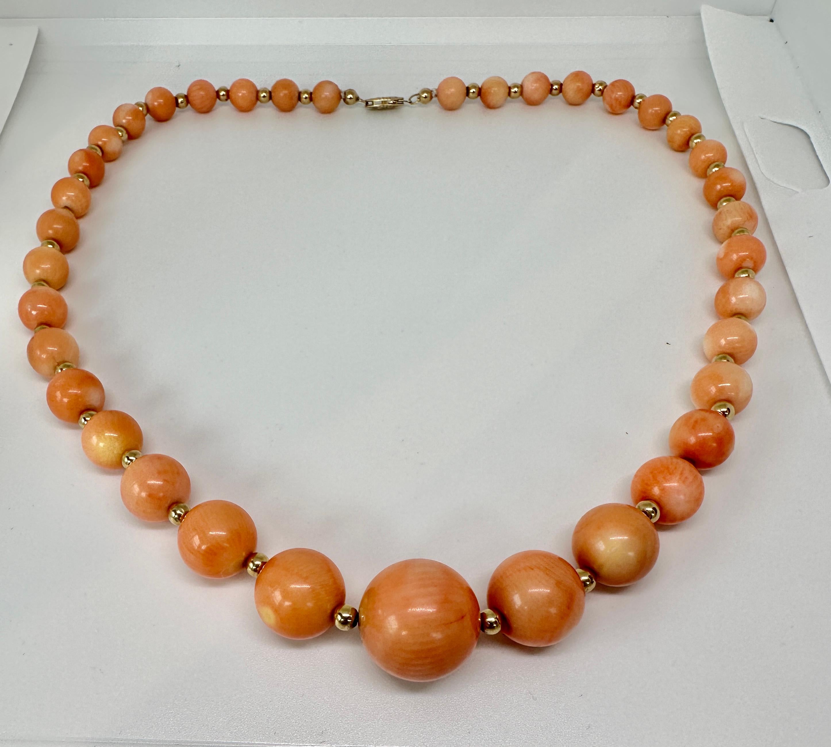 Indulge in this significant antique pink natural 18 mm Momo Coral and 14 Karat Gold Necklace.  The marbled pattern on each bead will send you to bliss with its charming beauty and appeal.  The magnificent Momo Coral beads are graduated from 8mm to