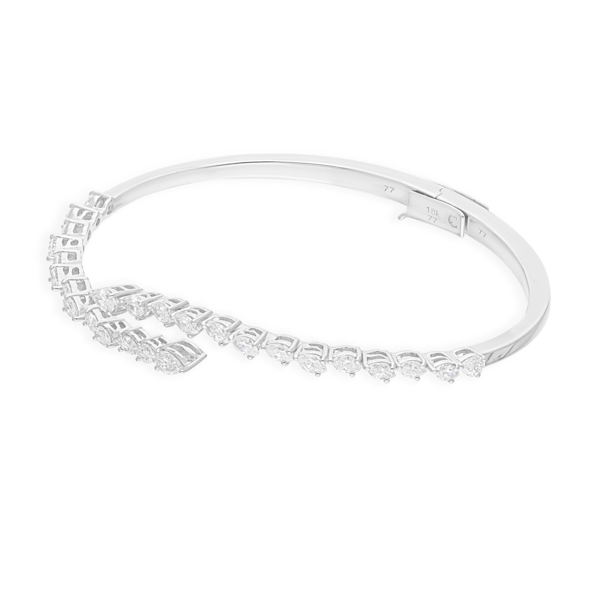 Cast from 18-karat gold, these exquisite bangle is handset with 1.91 carats of sparkling diamonds.

FOLLOW SPECTRUM JEWELS storefront to view the latest collection & exclusive pieces. Spectrum Jewels is proudly rated as a Top Seller on 1stdibs with