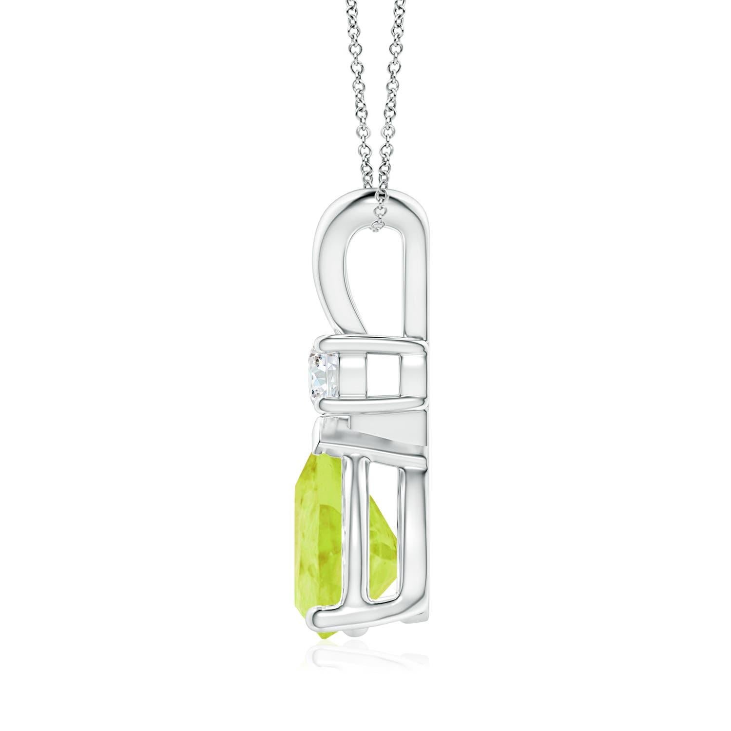 This classic solitaire pendant features a pear-shaped peridot, secured in a prong setting. A sparkling round diamond sits atop the earthy green gemstone adding to the design's allure. This peridot pendant in platinum dangles is crafted with a