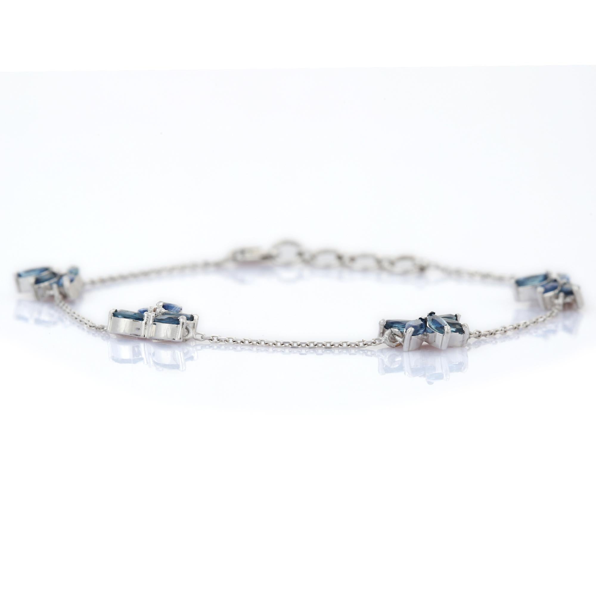 Contemporary Natural 1.98 Ct Blue Sapphire Floral Charm Bracelet Studded in 18K White Gold For Sale