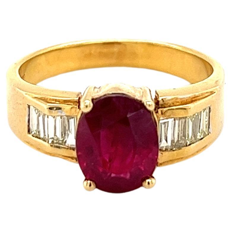Natural 2 Carat Oval Cut Ruby and Baguette Cut Diamond Sides in 18K Gold Ring For Sale