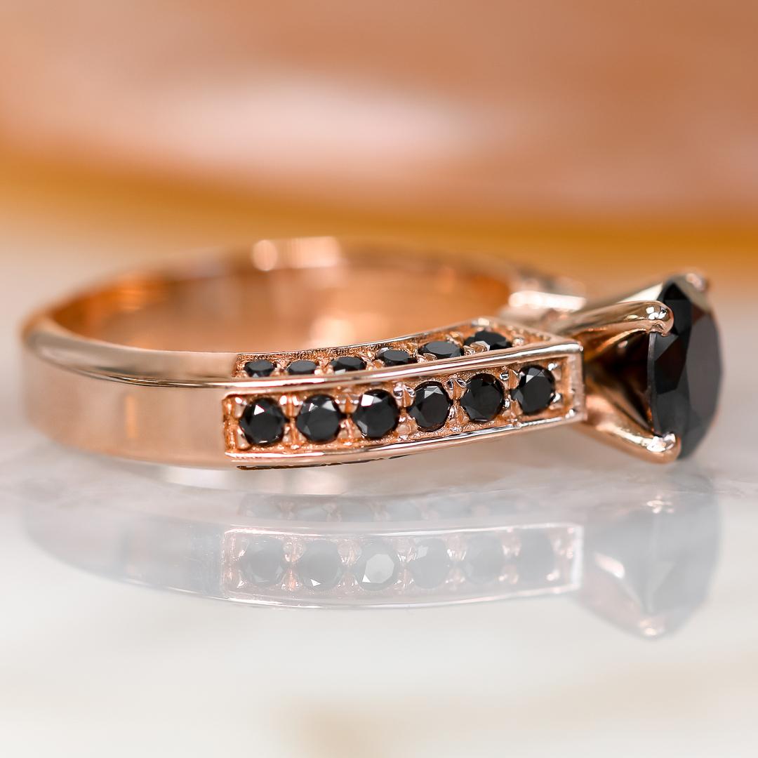 Bow-Tie -  Art Deco Natural Black & White Round Diamond Ring featuring Round cut diamonds. 

This stunning diamond wedding band features 1.80 carats of shimmering diamonds set in a dramatic rose gold band. The accent diamonds extend halfway, on