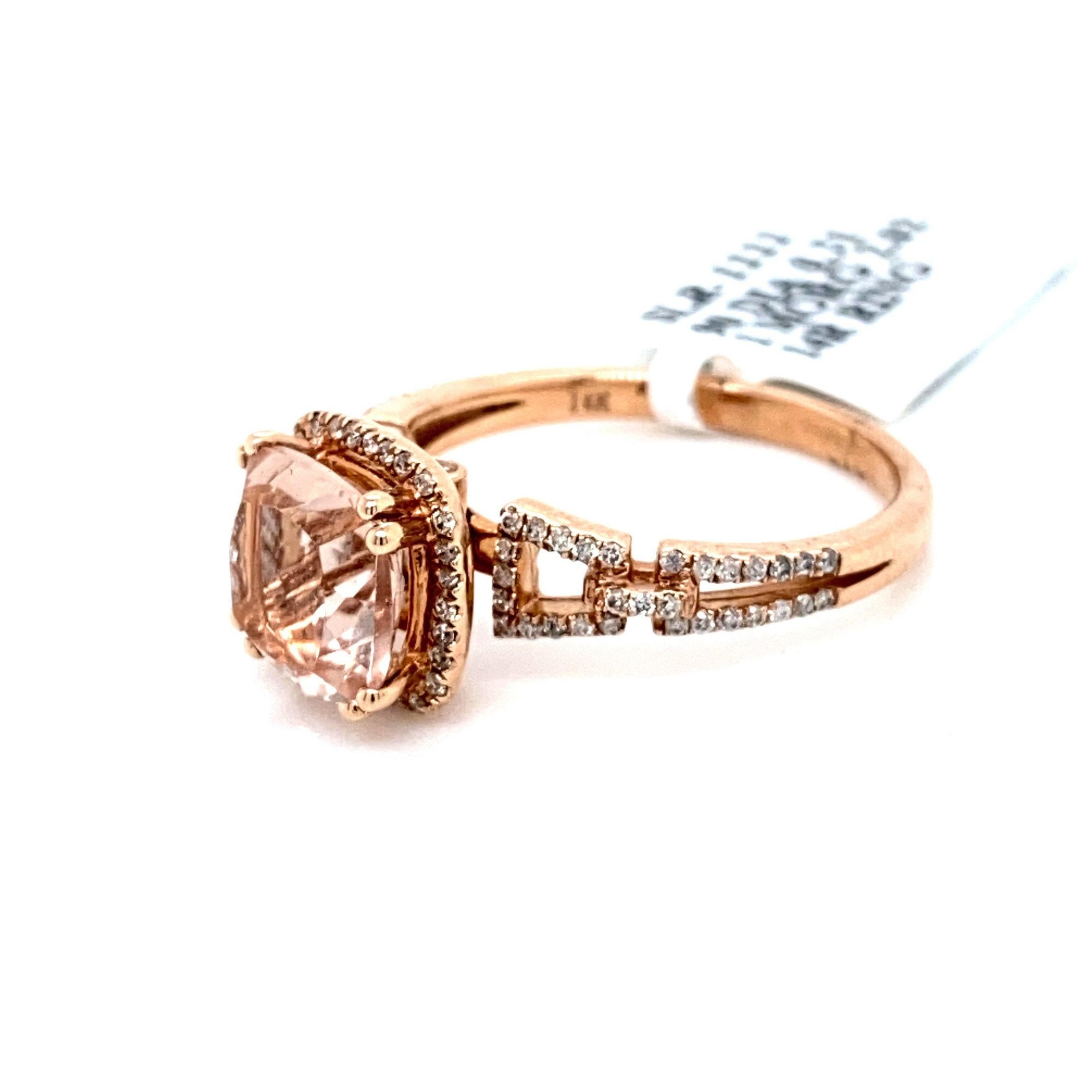 This stunning natural morganite and diamond halo ring set is in an alluring 14K rose gold chain link setting. The natural 8MM 2.02 carat Cushion cut morganite has an excellent peachy pink color (AAA quality gem) and is surrounded by a halo of round