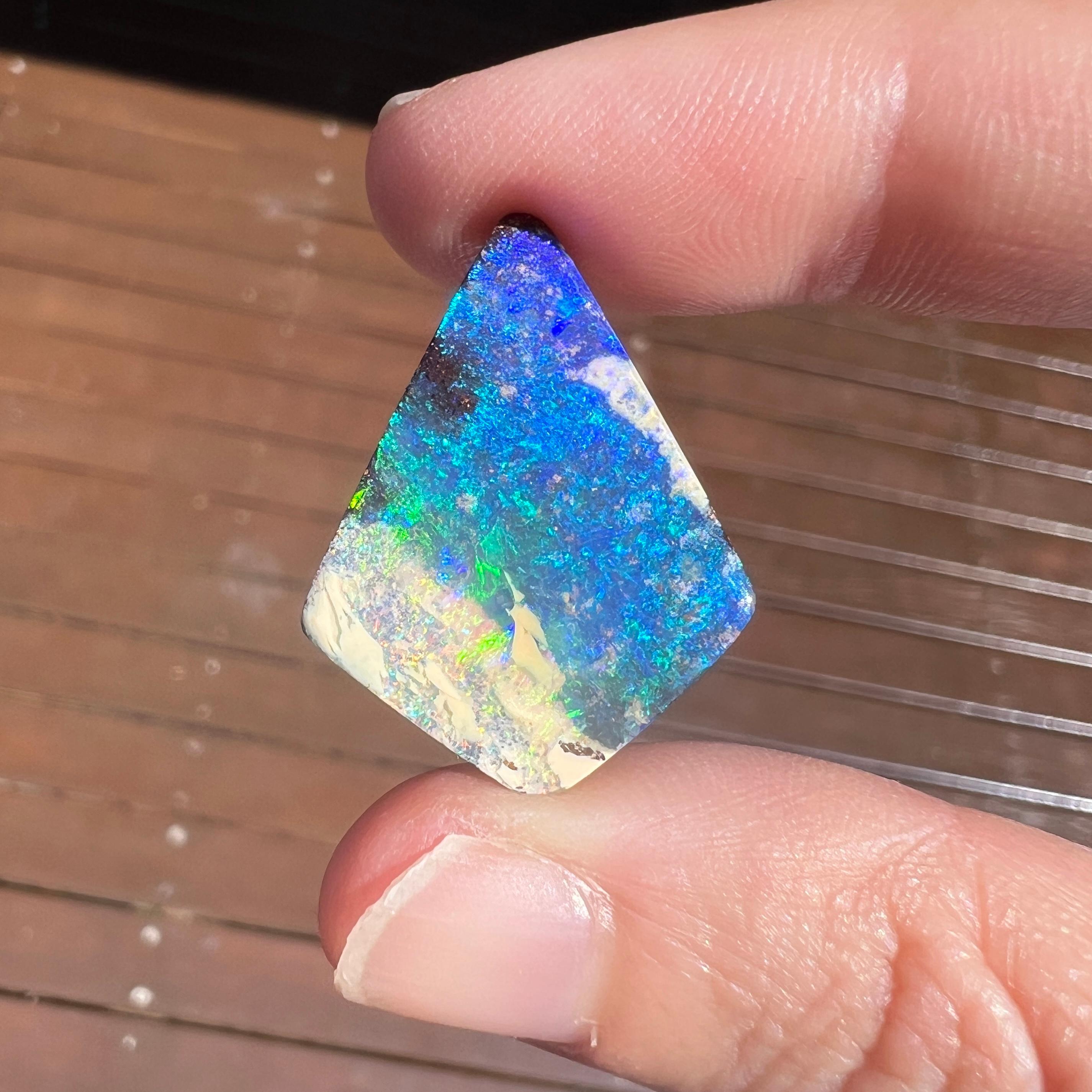 This unique 20.39 Ct Australian boulder opal was mined by Sue Cooper at her Yaraka opal mine in western Queensland, Australia in 2020. Sue processed the rough opal herself and cut into into a kite-shape. She selected to keep the natural light white