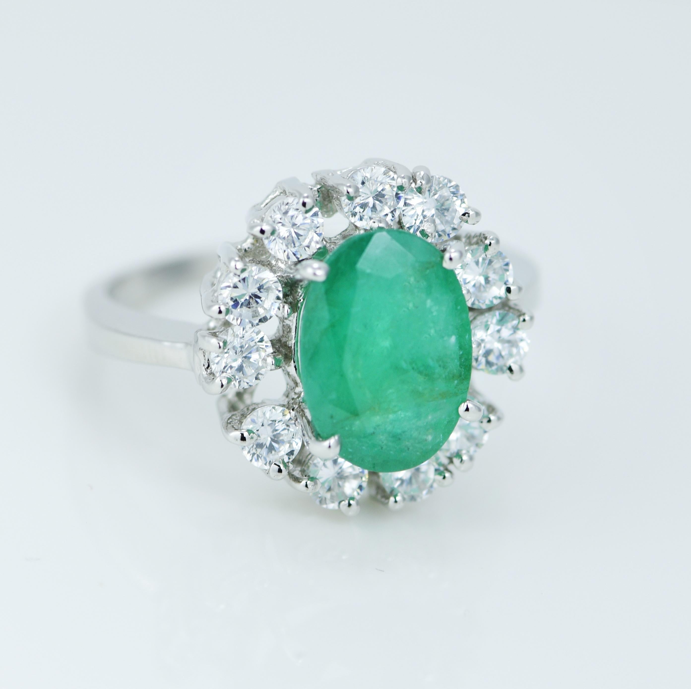 Modern Natural 2.15 Carat Emerald Halo Ring For Sale