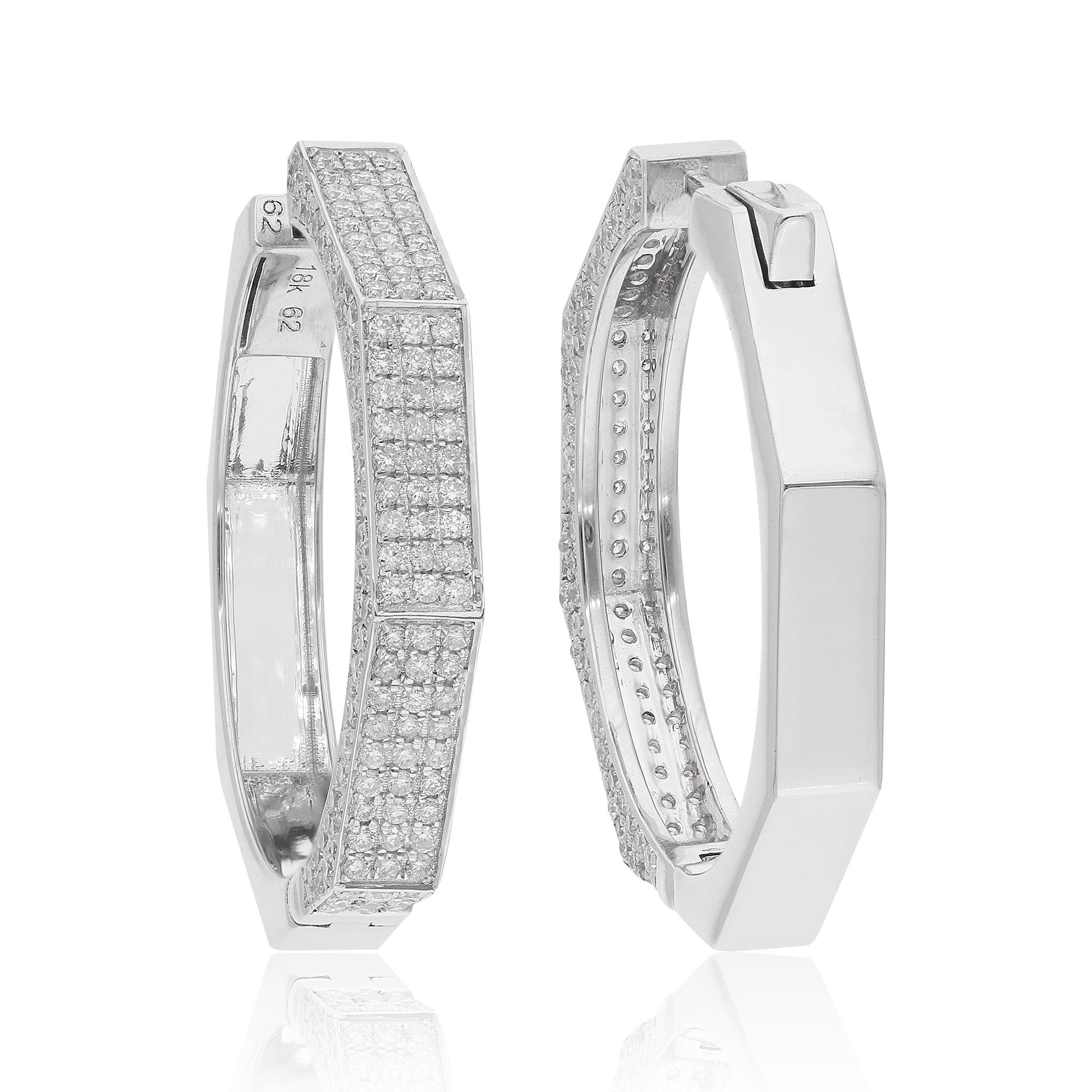 Indulge in the luxurious glamour of these pave diamond hoop earrings, meticulously crafted in 14 karat white gold. Each earring showcases a dazzling array of natural diamonds totaling 2.17 carats, expertly set in a pave setting to create a