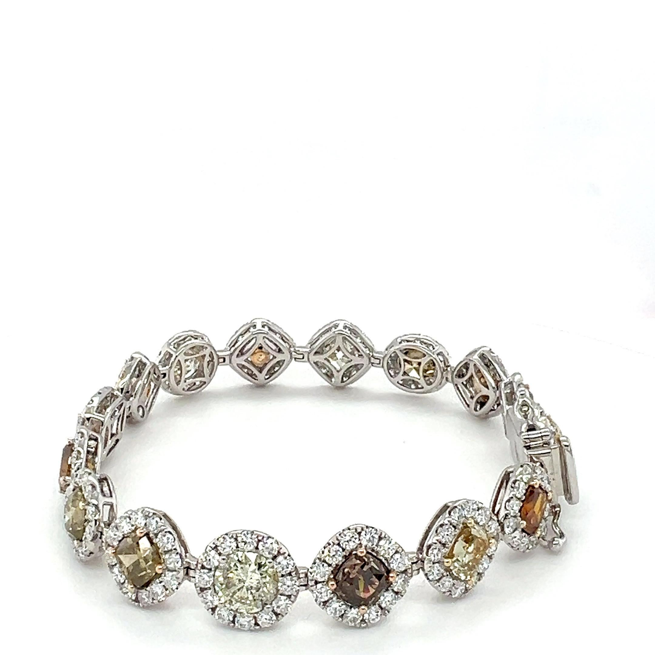 Natural 16 diamond weighing 16.36 and halo of white round diamonds 5.63 carat set in 18K two tone gold is one of a kind bracelet. The bracelet is 7.5 inches long . All the color diamonds are natural color which is 3rd rarest color orange, champagne,