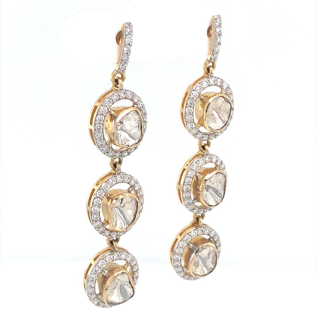 A 2.21 carat natural diamond earring set in 18 carat yellow gold with a very high VS quality diamonds. 