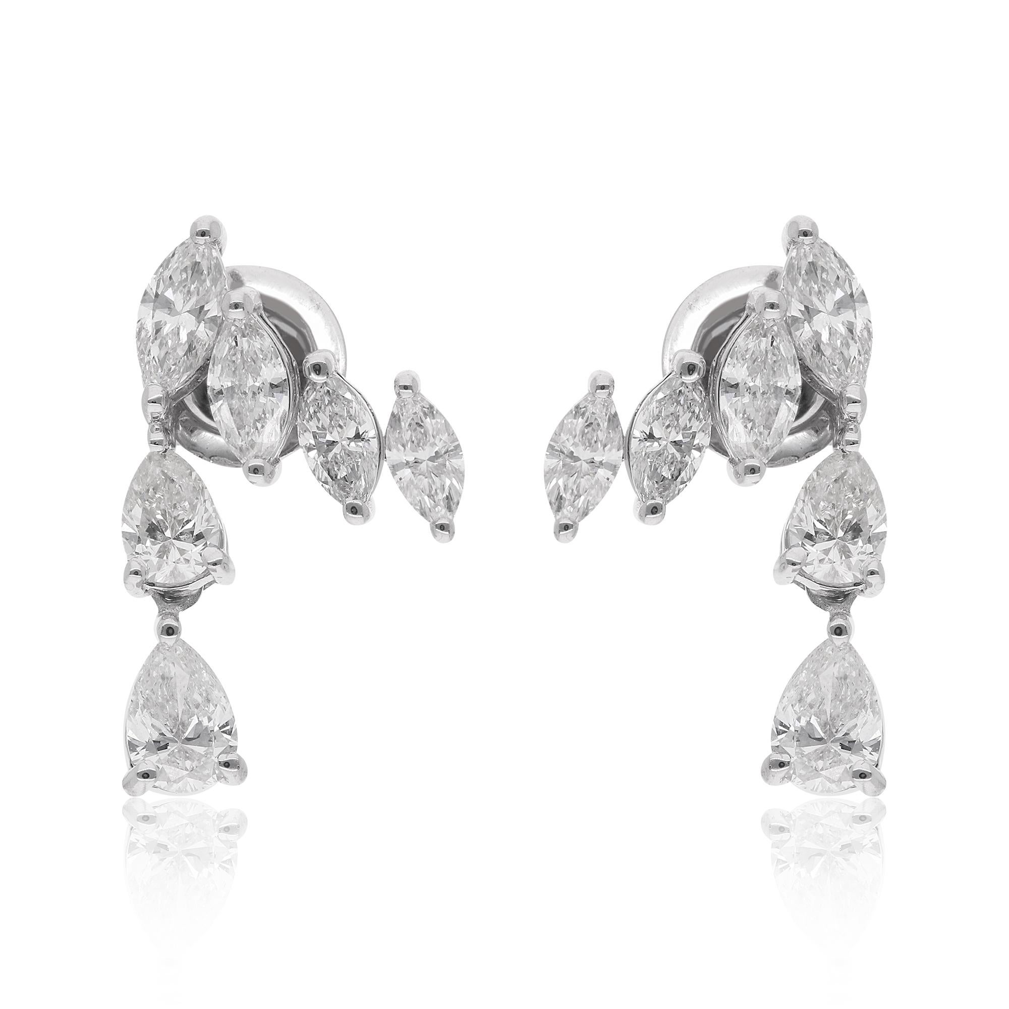 At the heart of each earring, a stunning pear-shaped diamond glimmers with ethereal brilliance, reflecting light in every direction with its pristine facets. These captivating pear diamonds are expertly complemented by gracefully arranged marquise