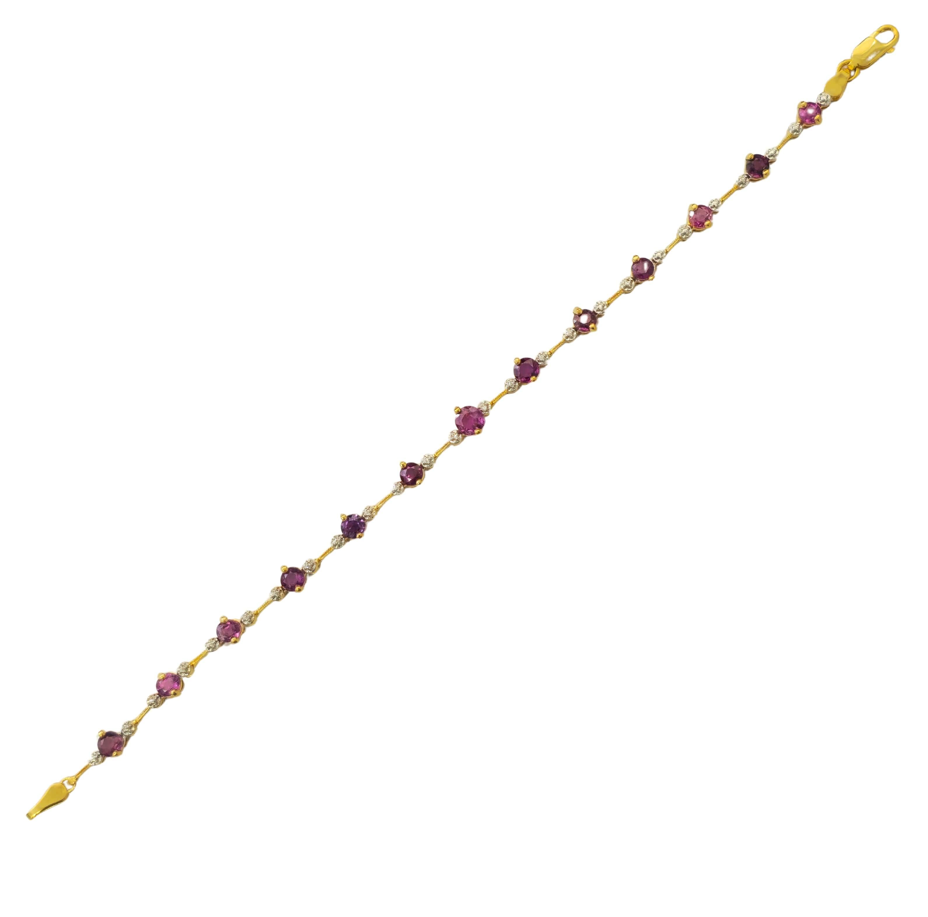 Fashioned from elegant 10k yellow gold, this collectible gemstone fine jewelry piece showcases stunning rubelite gemstones totaling 2.30 carats, each intricately cut into round shapes to enhance their natural beauty. Weighing 5.60 grams and