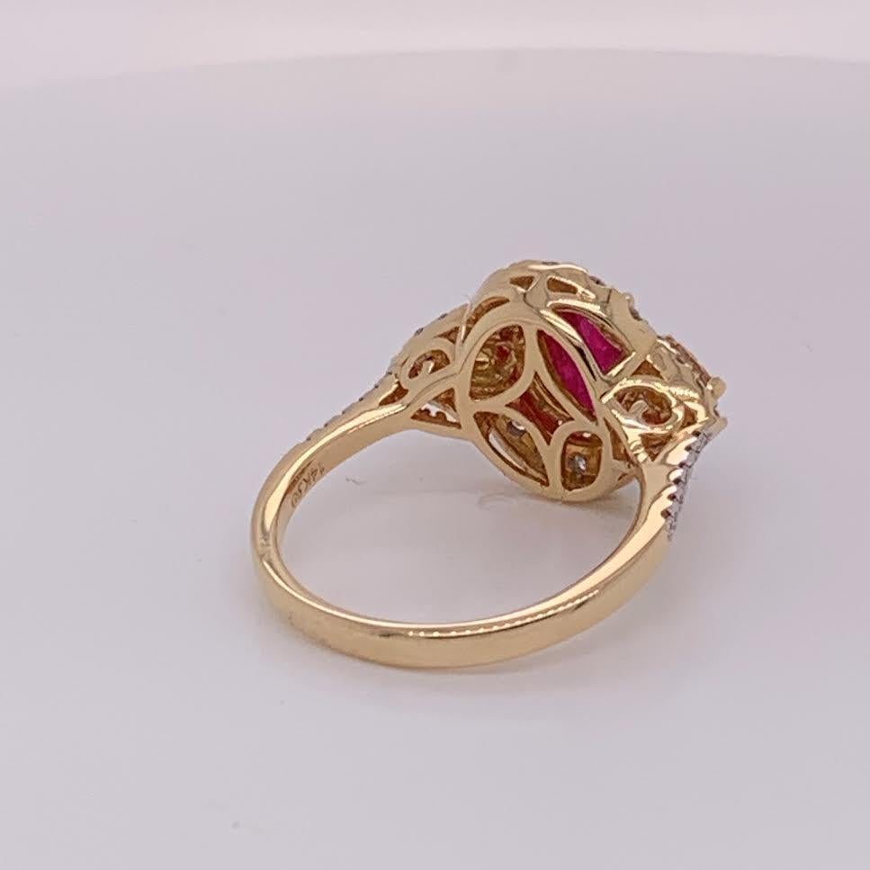 Natural 2.35 Carat Oval Ruby and total 0.74 Carat Diamonds( 0.39 Carat white Diamond and 0.35 Carat Pearshape yellow diamond ) set in 14 Karat yellow gold is one of a kind handcrafted ring. The ring is size 7 but can be resized if needed.