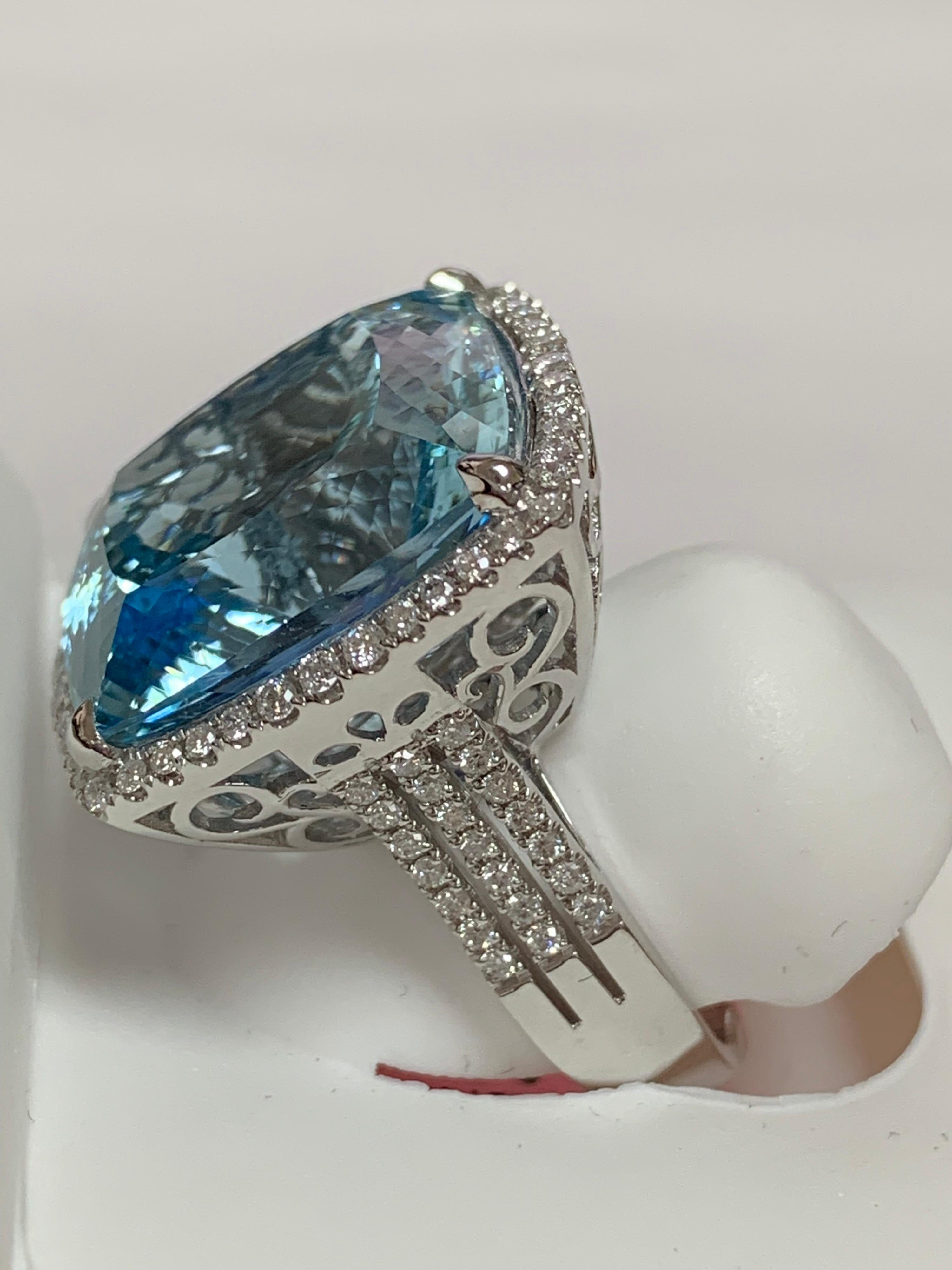 Natural Cushion shape 24.45 Carat Aquamarine and 0.65 Carat white diamonds set in 14 Karat white gold is one of a kind handcrafted ring.Size of the ring is 7 and can be resized if needed.