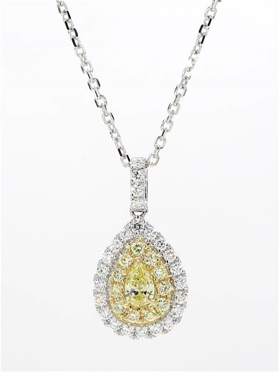 RareGemWorld's classic diamond necklace. Mounted in a beautiful 18K Yellow and White Gold setting with a natural pear cut yellow diamond. The yellow diamond is surrounded by small round natural white diamond melee and small round natural yellow