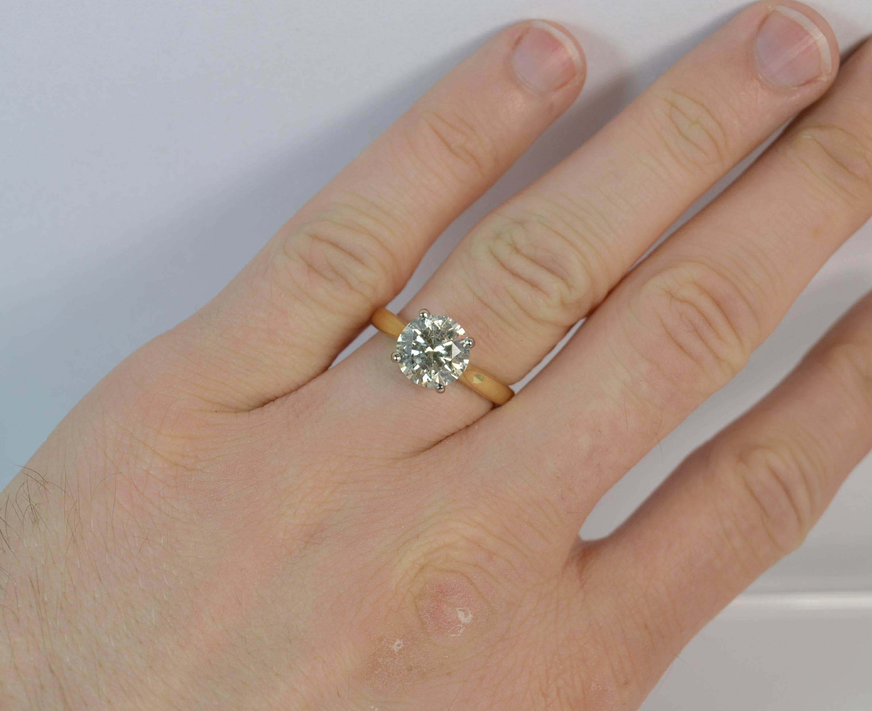 A very large natural diamond solitaire engagement ring.

​The round brilliant cut diamond measures 8.6mm in diameter and weighs 2.54 carats as confirmed to the inside of the shank.

​The diamond is i1 grade, colour j-k. Some small scattered