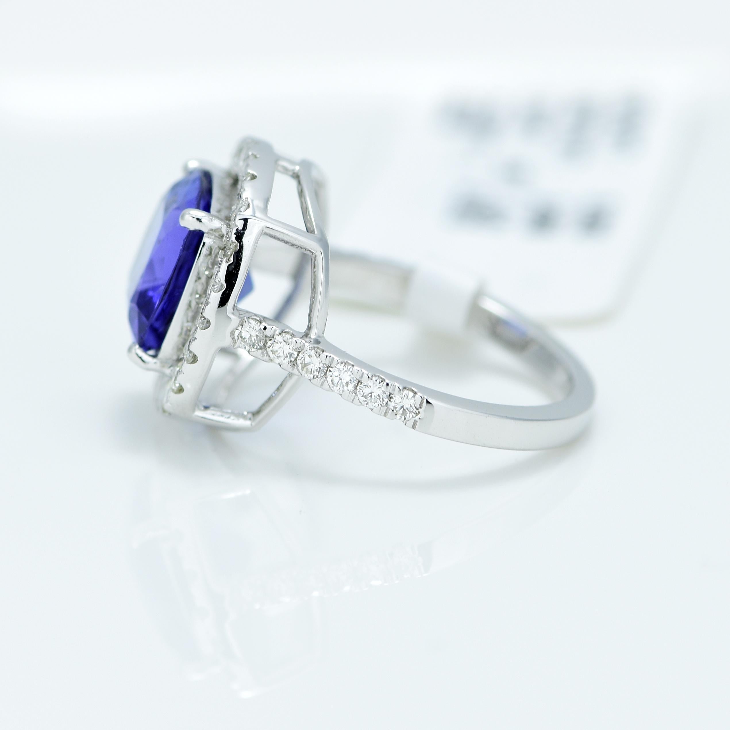 Stunning Violetish Blue Tanzanite and Diamond halo ring.

Centre Stone - Natural Tanzanite, 
Centre Stone Weight - 2.57 Carat, 
Centre Stone Shape & Cut - Square Cushion Step Cut
 
Total Number of Diamonds - 36, 
Diamonds Carat Weight - 0.61