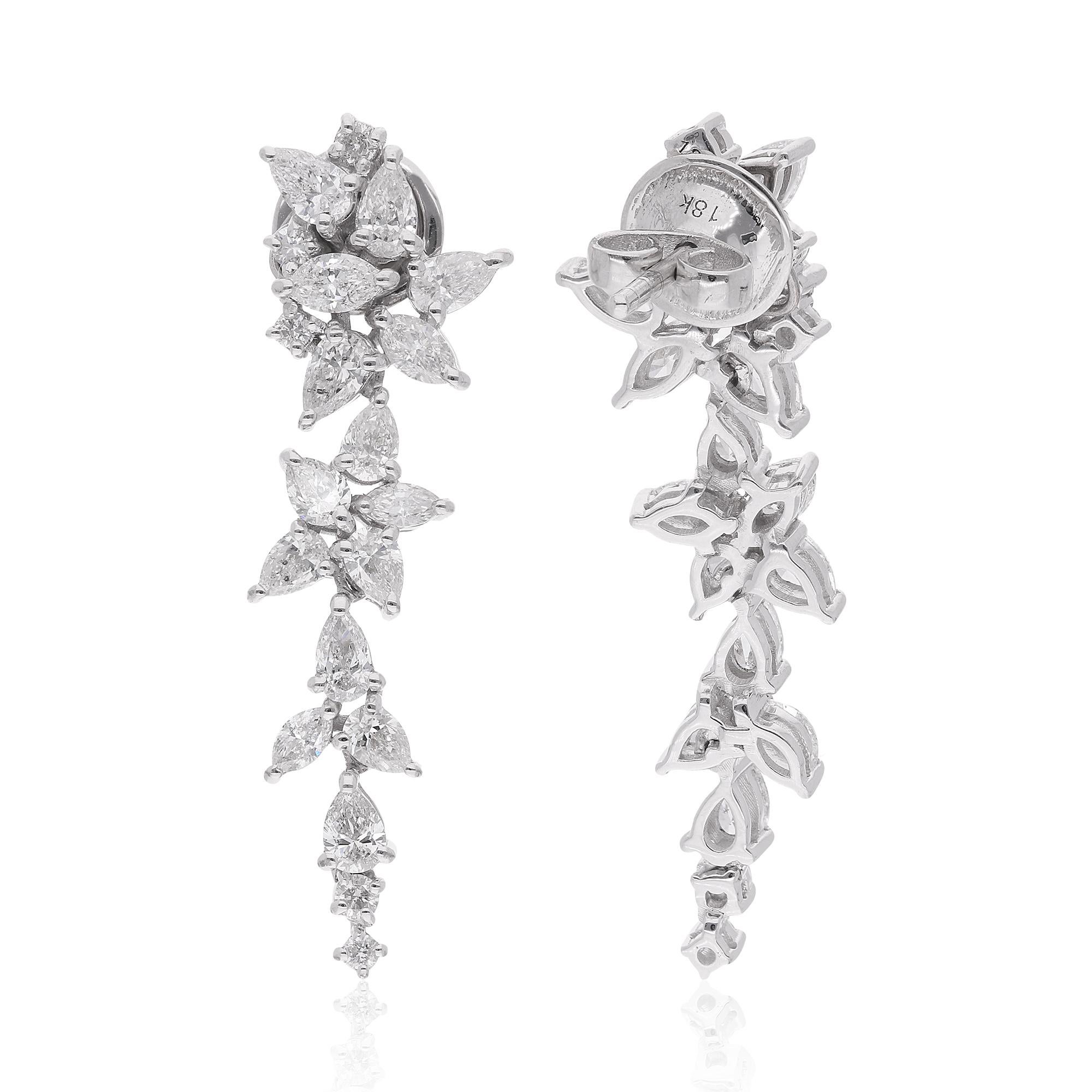 Elevate your ensemble to new heights with these breathtaking round, pear, and marquise diamond earrings, crafted with meticulous care in 14 karat white gold. Each earring features a stunning combination of natural diamonds totaling an impressive