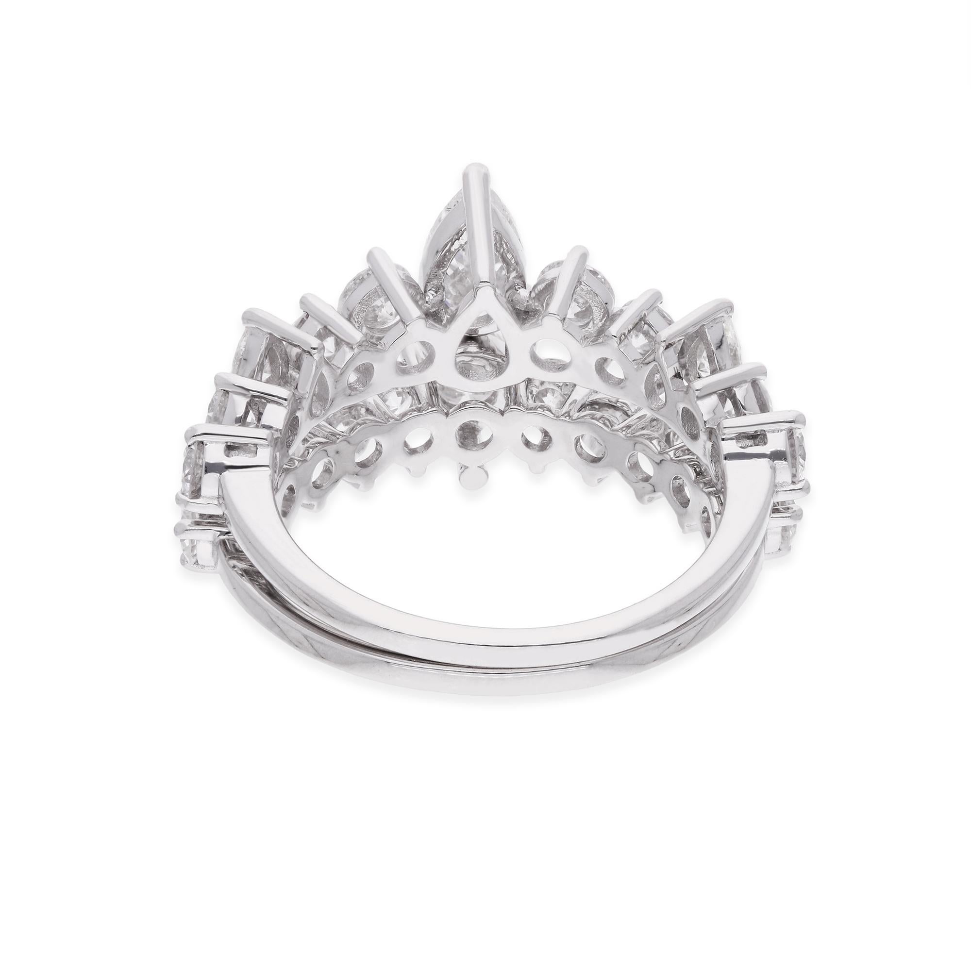 The diamond is securely nestled within a setting of lustrous 14 karat white gold, chosen for its enduring beauty and exceptional quality. Meticulously handcrafted by skilled artisans, the intricate design of the ring showcases the diamond in all its