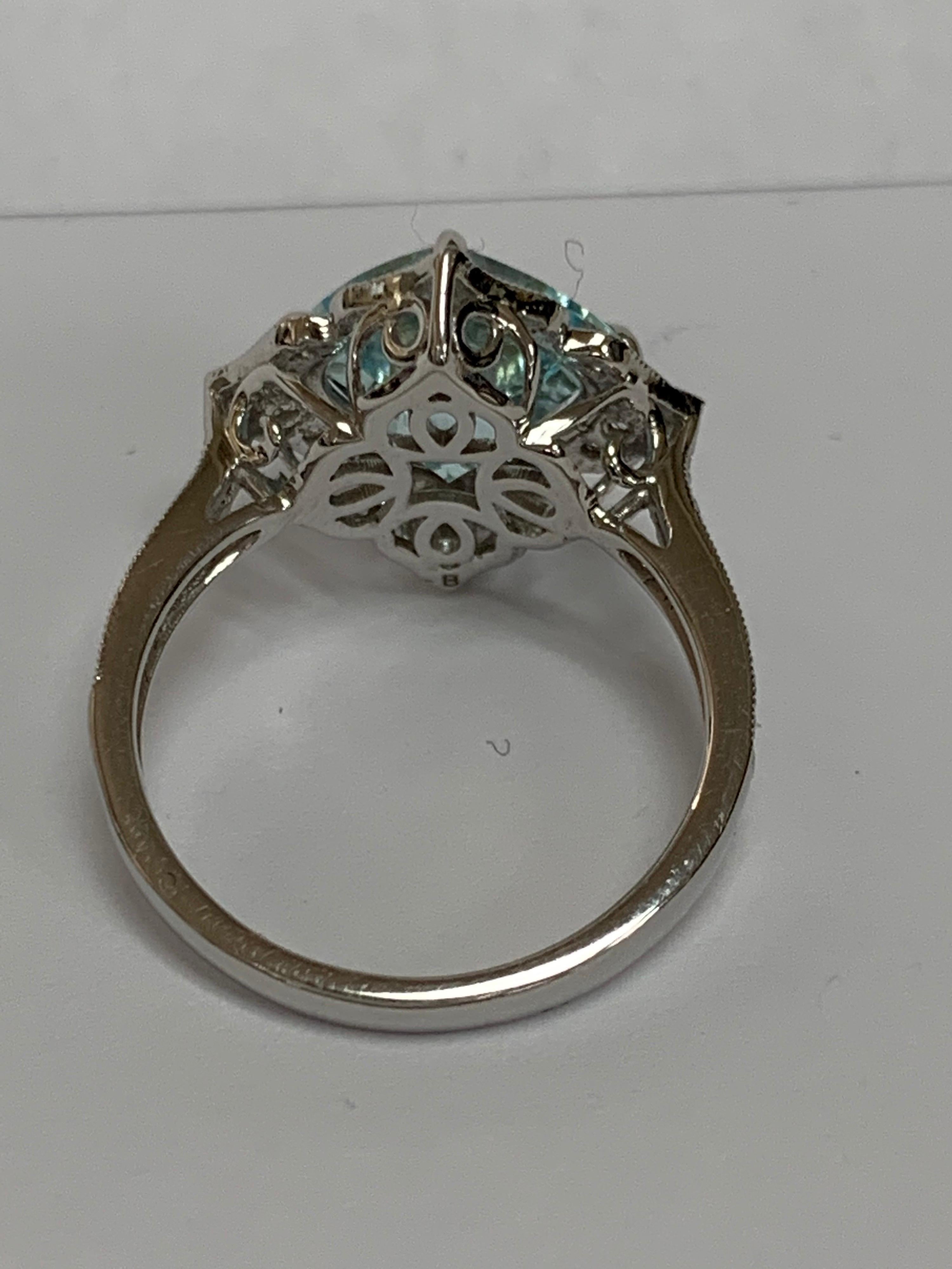 Natural Cushion cut beautiful aquamarine with 0.31 Carat round diamonds accents set in 14 Karat white gold is one of a kind handcrafted Ring, Size of the ring is 7 and can be resized if needed.