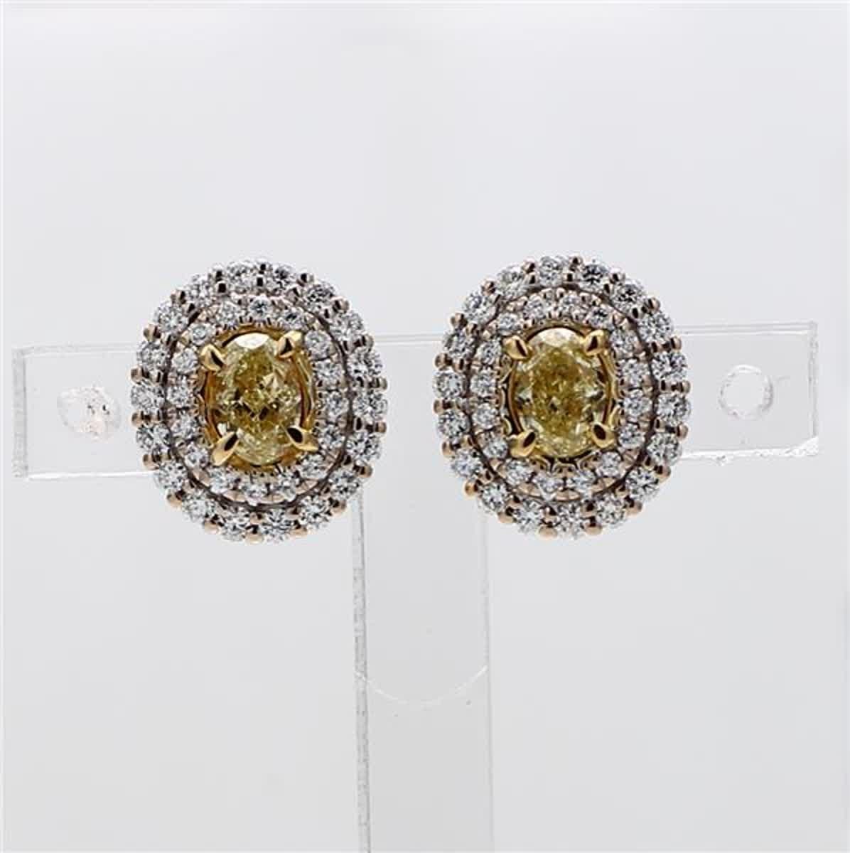 RareGemWorld's classic natural oval cut yellow diamond earrings. Mounted in a beautiful 18K Yellow and White Gold setting with natural oval cut yellow diamonds. The yellow diamonds are surrounded by a double halo of small round natural white diamond