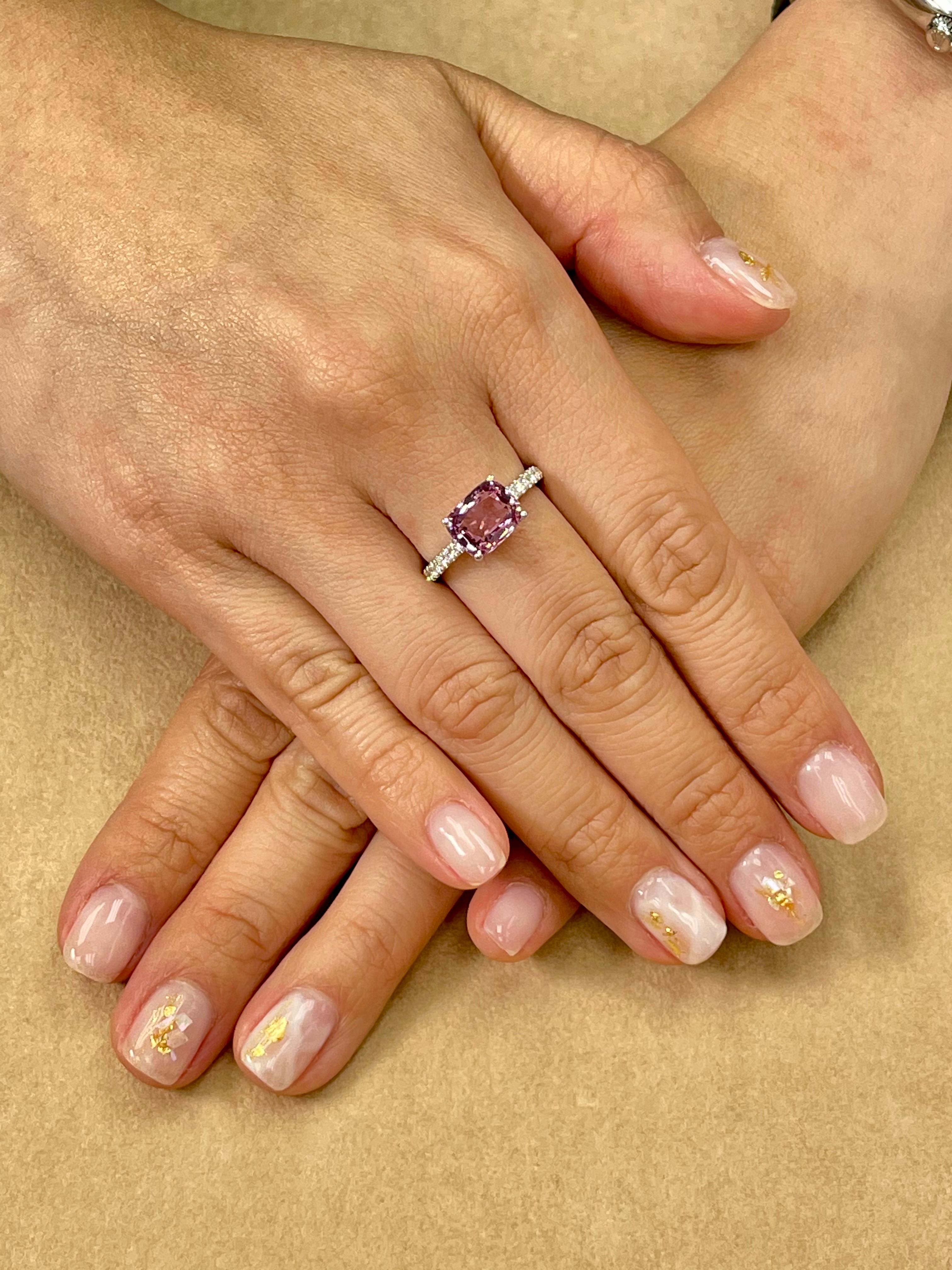 Please check out the HD video! Here is a wonderful pink Spinel and diamond cocktail ring. The ring is set in 18k white gold and diamonds. The natural spinel has a beautiful pink color, not too deep not too light. There are 0.20Cts of small round