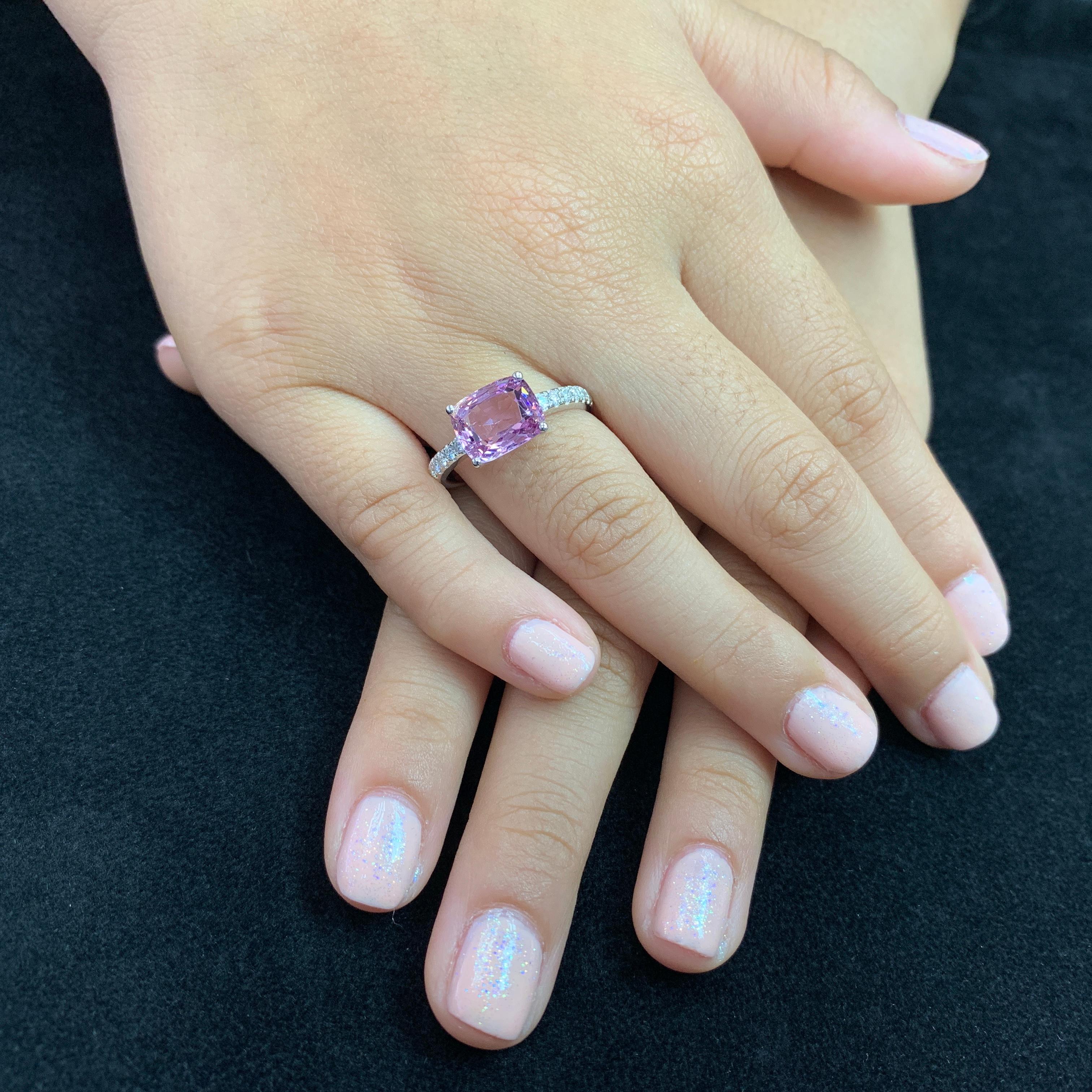 Here is a wonderful Spinel ring. The ring is set in 18k white gold and diamonds. There are 0.20Cts of small round diamonds on each sides of the center Spinel. The Natural Spinel is almost loupe clean. The color is crispy. The ring is full of life.