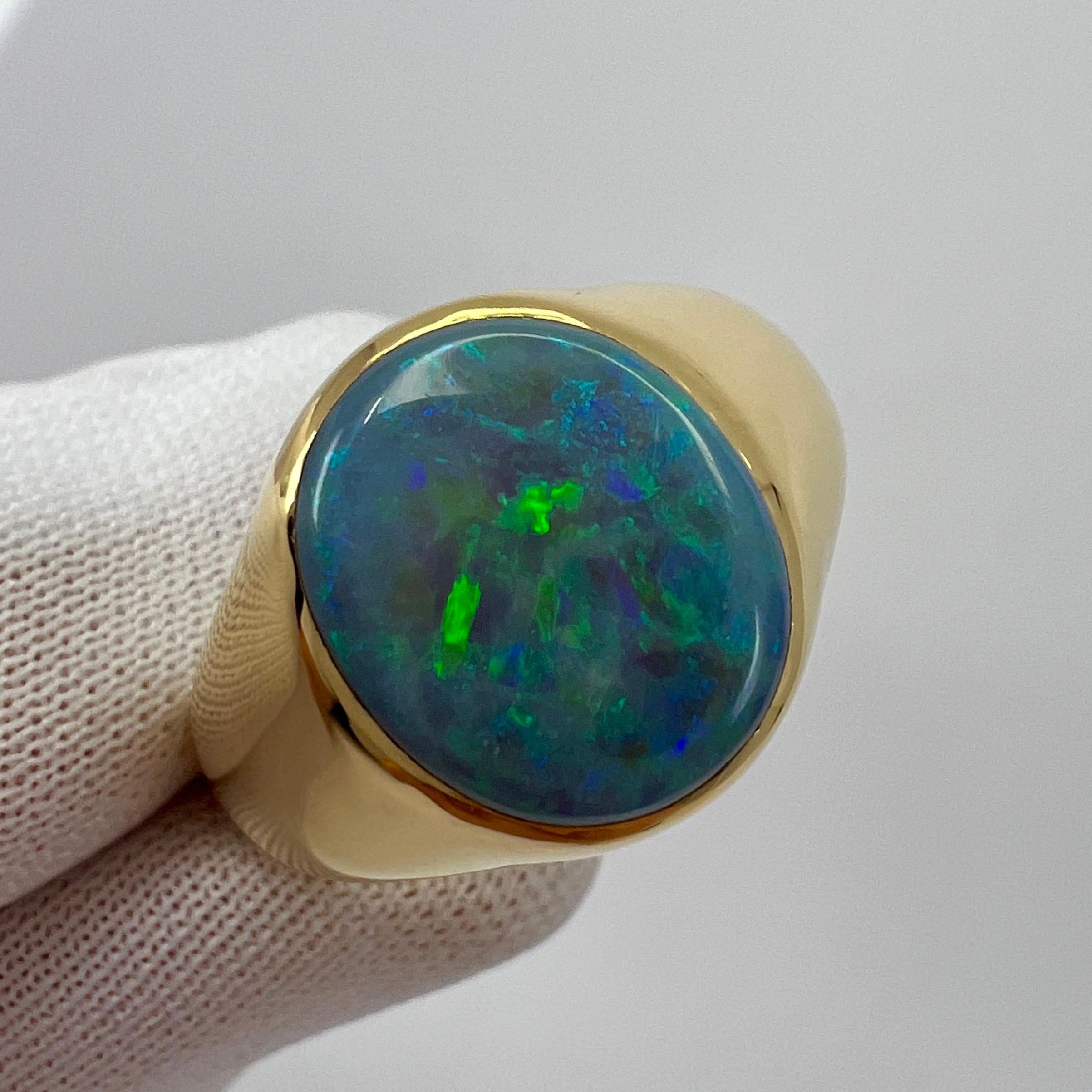 Fine Australian Lightening Ridge Black Opal 18k Yellow Gold Signet Ring.

A stunning 3.04 carat natural black opal with a beautiful play of colour and an excellent oval cabochon cut. Set in a bespoke made 18k yellow gold rubover bezel signet ring.