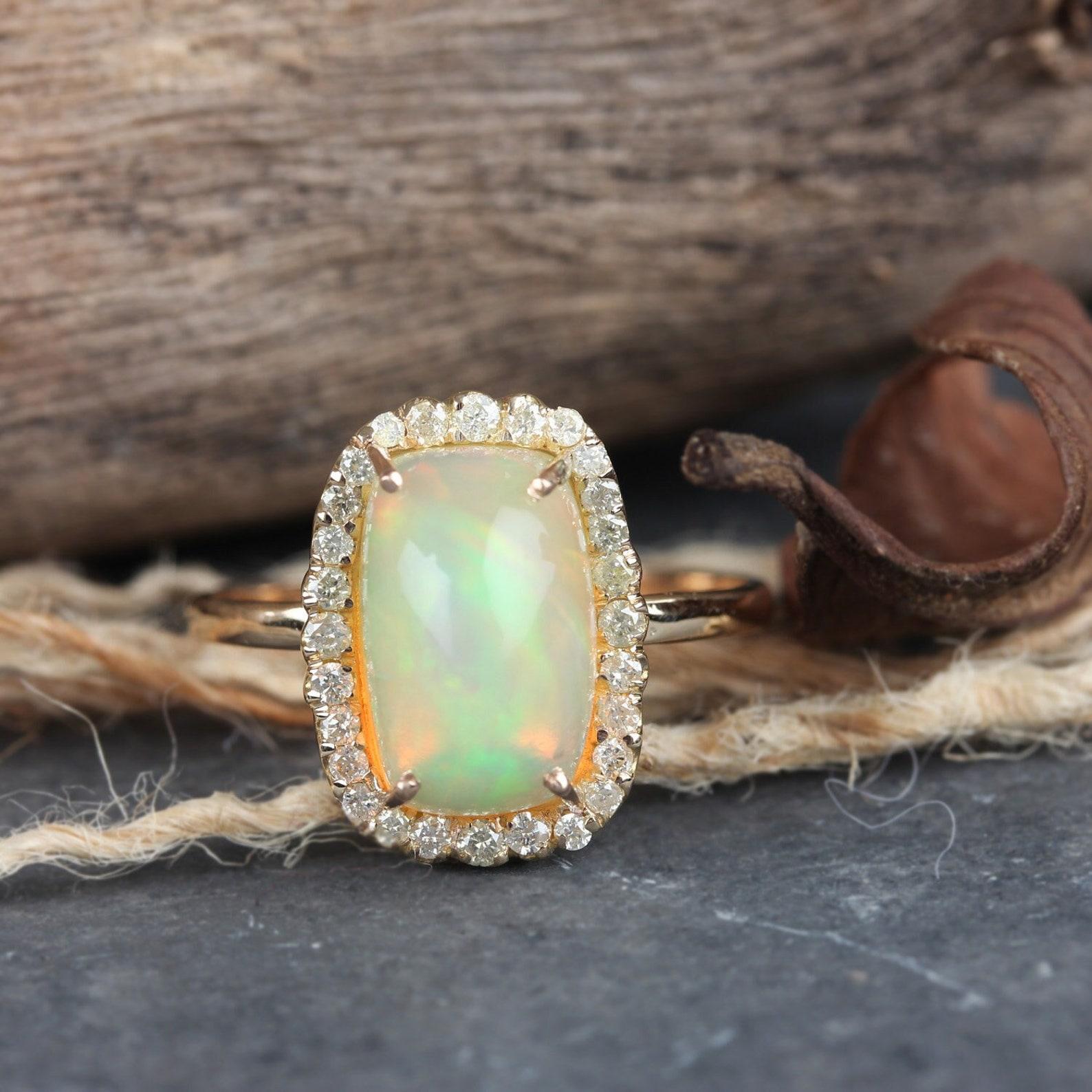 Natural 3.27 Ct Ethiopian Opal Pave Diamond Cocktail Ring Solid 14k Gold Ring.

Main Metal:- 14K Solid Yellow Gold (as shown)
Gold Weight:- 1.72 gm
Gross Weight:- 2.43 gm
Diamond Weight:- 0.27 ct
Opal Weight:- 3.27 ct
Ring Size:- 15*11 mm & 7 us