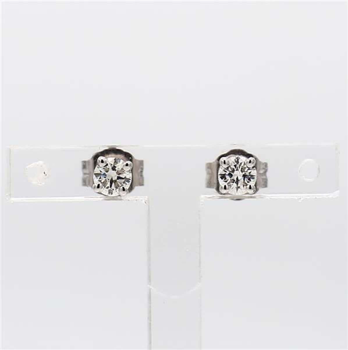 RareGemWorld's classic natural round cut white diamond earrings. Mounted in a beautiful 14K White Gold setting with natural round cut white diamonds. These earrings are guaranteed to impress and enhance your personal collection!

Total Weight: