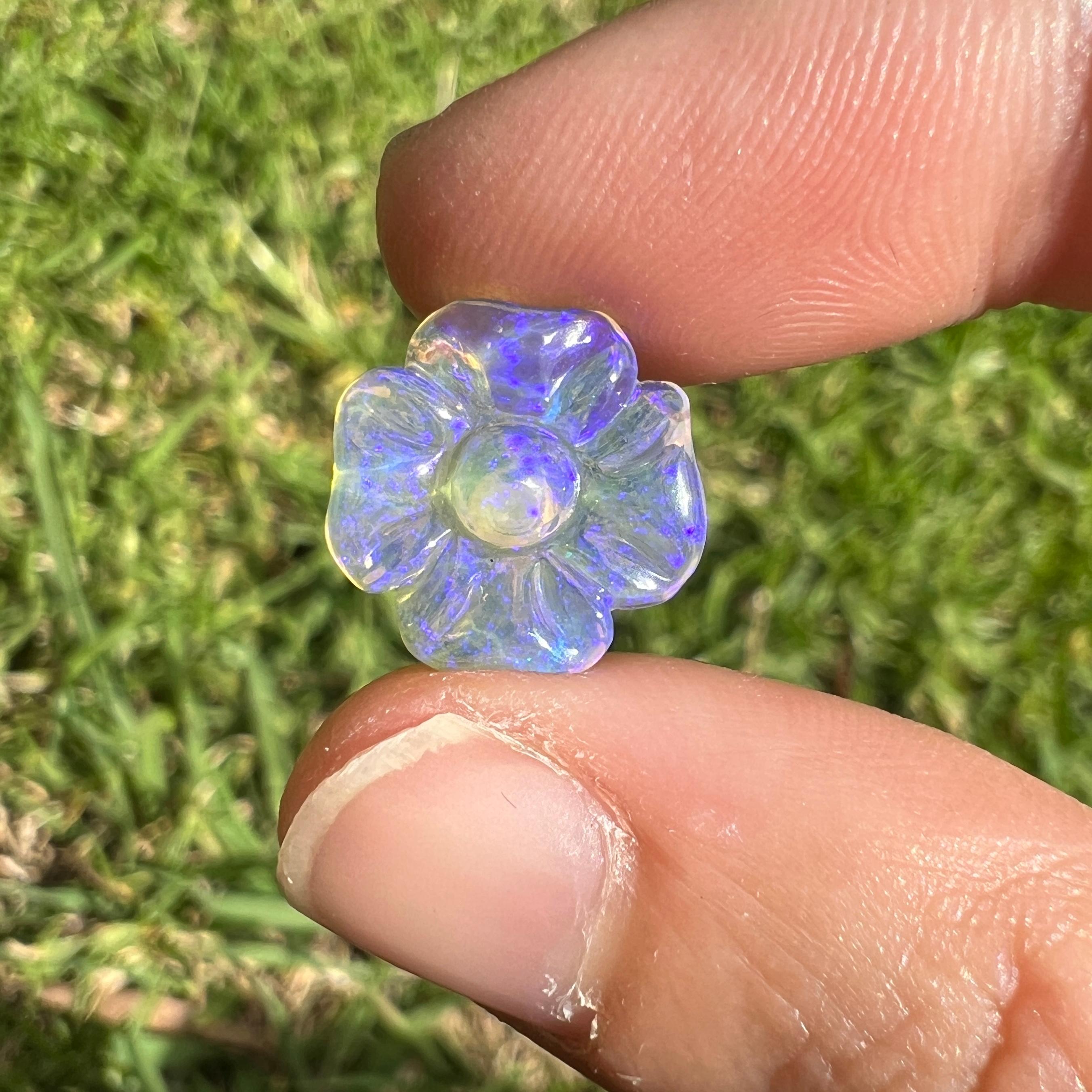 This beautiful 3.33 Ct Australian wood replacement opal was mined by Sue Cooper at her Russells opal mine in western Queensland, Australia in 2021. Sue processed the rough opal herself and selected it to be carved into a flower. The opal's size of