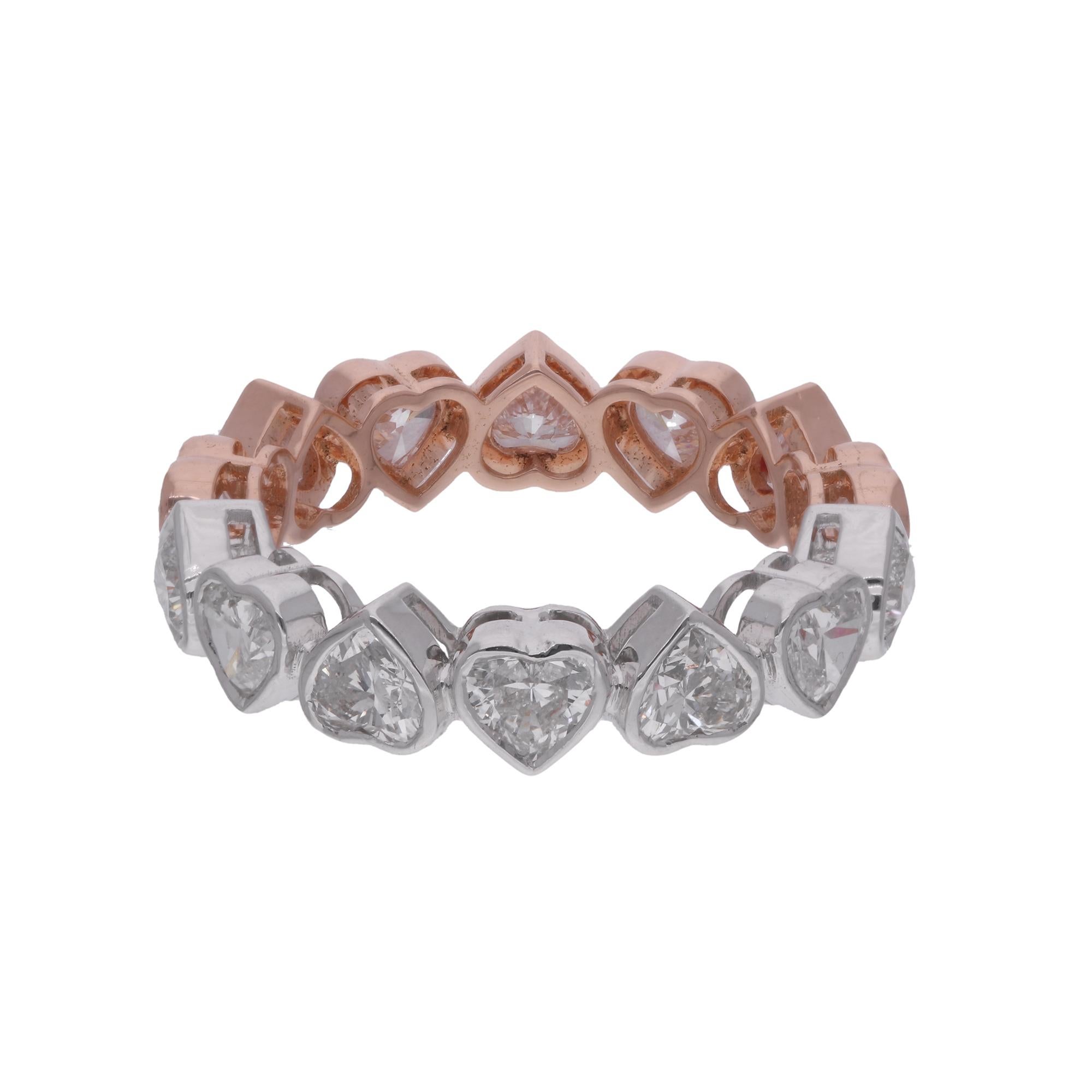 Crafted with precision and care, the heart-shaped diamond is embraced by a band of 18 karat rose gold, adding warmth and femininity to the design. The band is delicately accented with shimmering white gold, creating a striking contrast that enhances